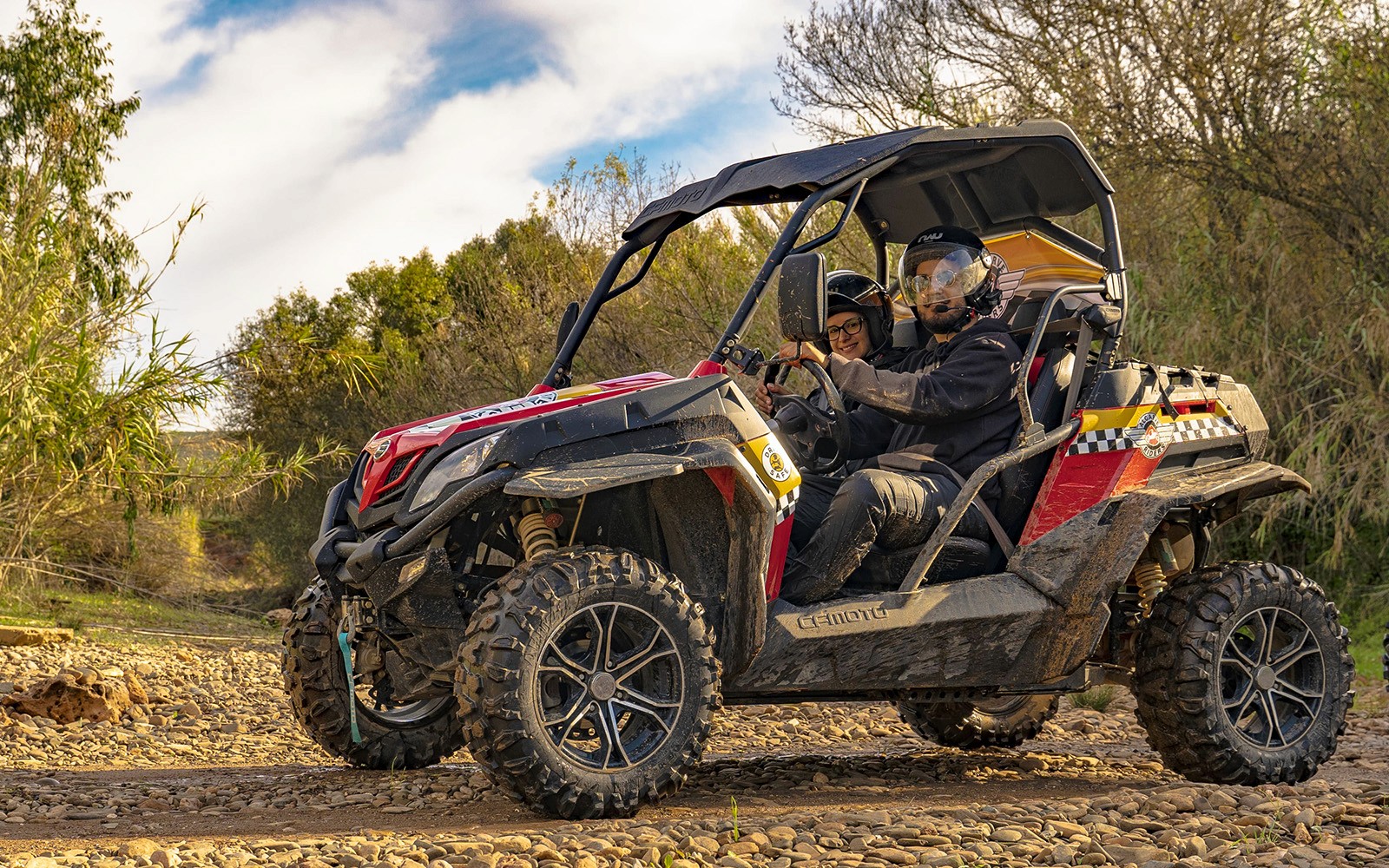 Buggy driving on rocky terrain during Algarve tour.