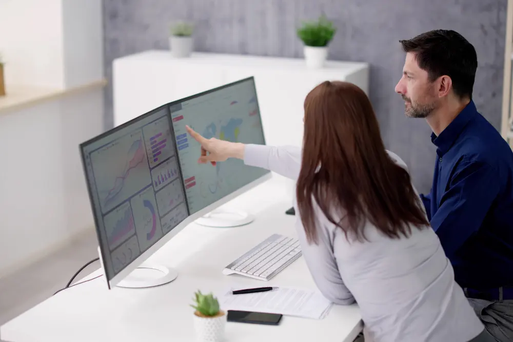 Healthcare team using staffing analytics software to manage nurse schedules