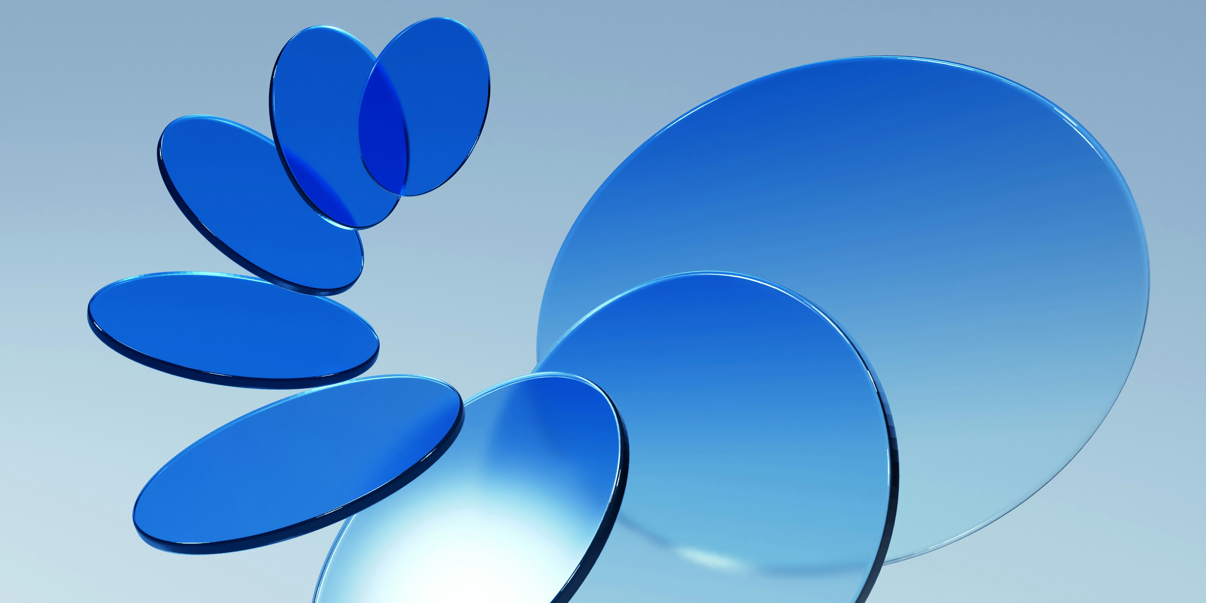 a group of blue circular objects floating in the air