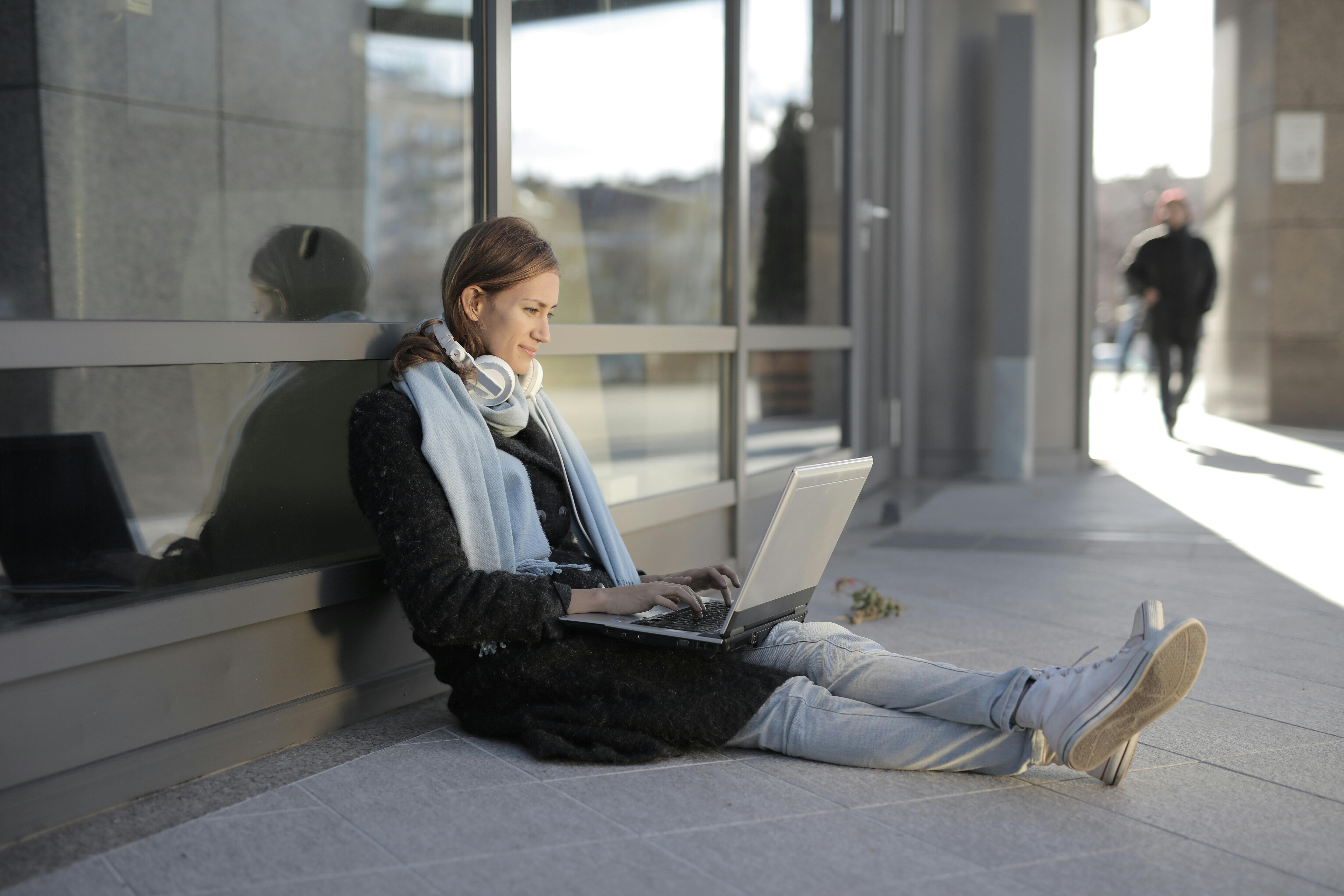 Woman writing cold emails with optimal length for maximum response rate