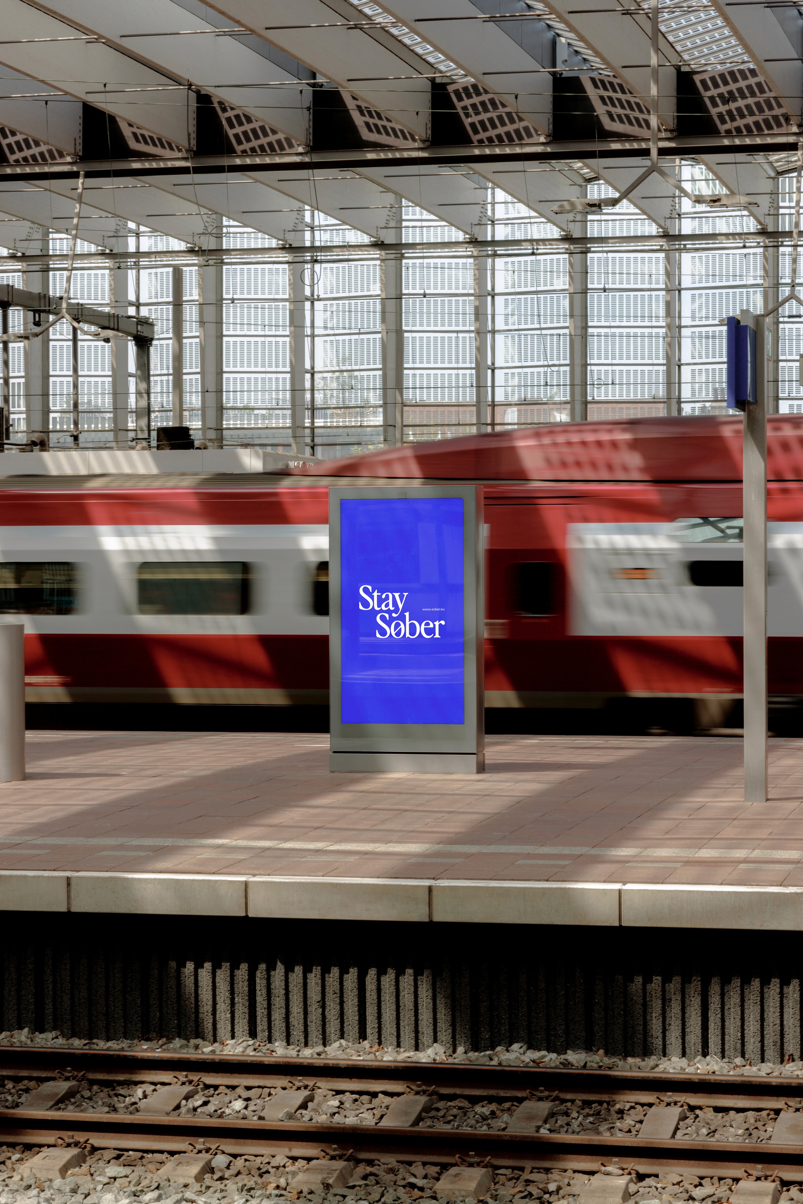 Streetside billboard with flyposters of the Batch.Works brand and illustrations