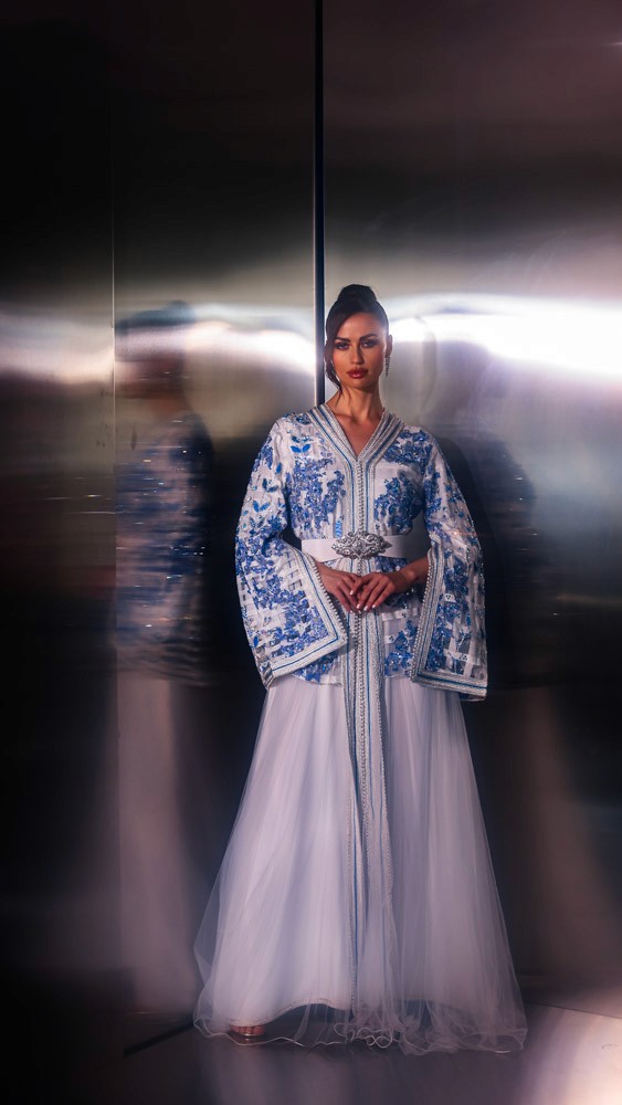 Light blue Moroccan bridal caftan with intricate hand embroidery, luxury handcrafted piece for weddings in Bahrain