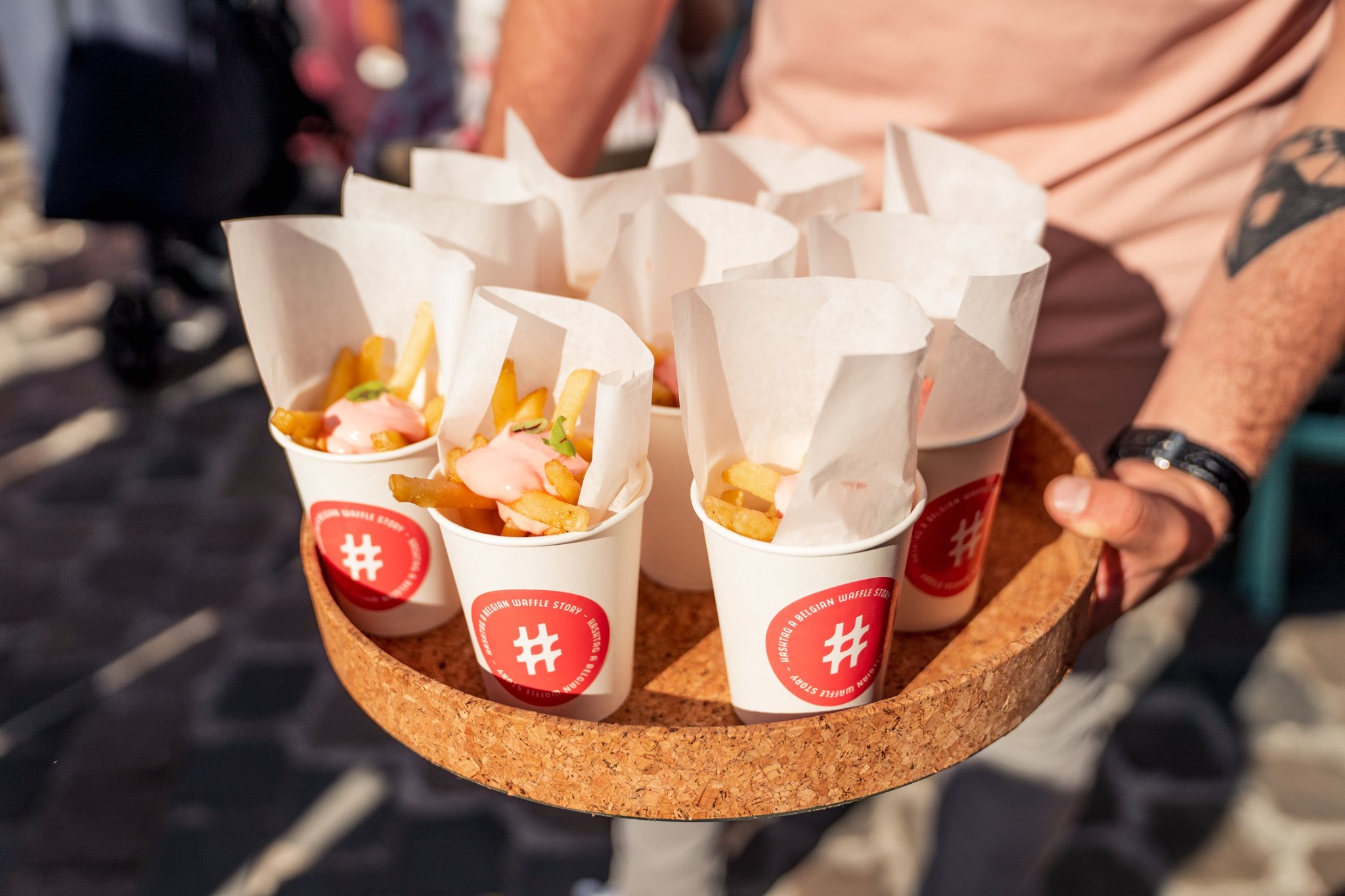 Three slim, upright orange packaging boxes side by side, each showing a partial black smiley face and “Smiley Co” text on the top, with a matching orange background.