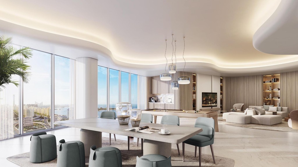 Bright and modern living room and dining area in Palm Beach Tower 2, featuring minimalist decor and an open floor plan.