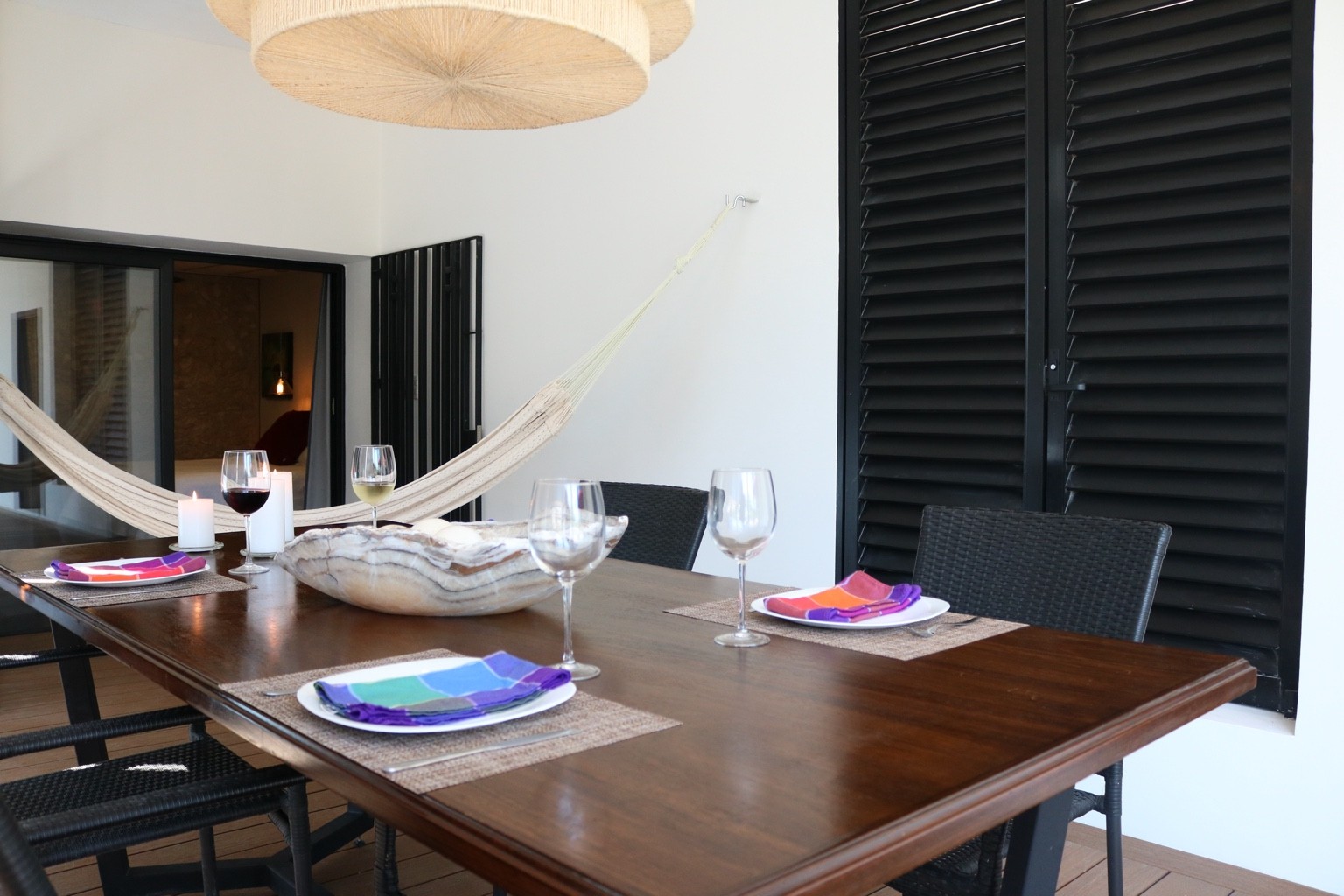 Bugambilia Apartment terrace dining area with hammock