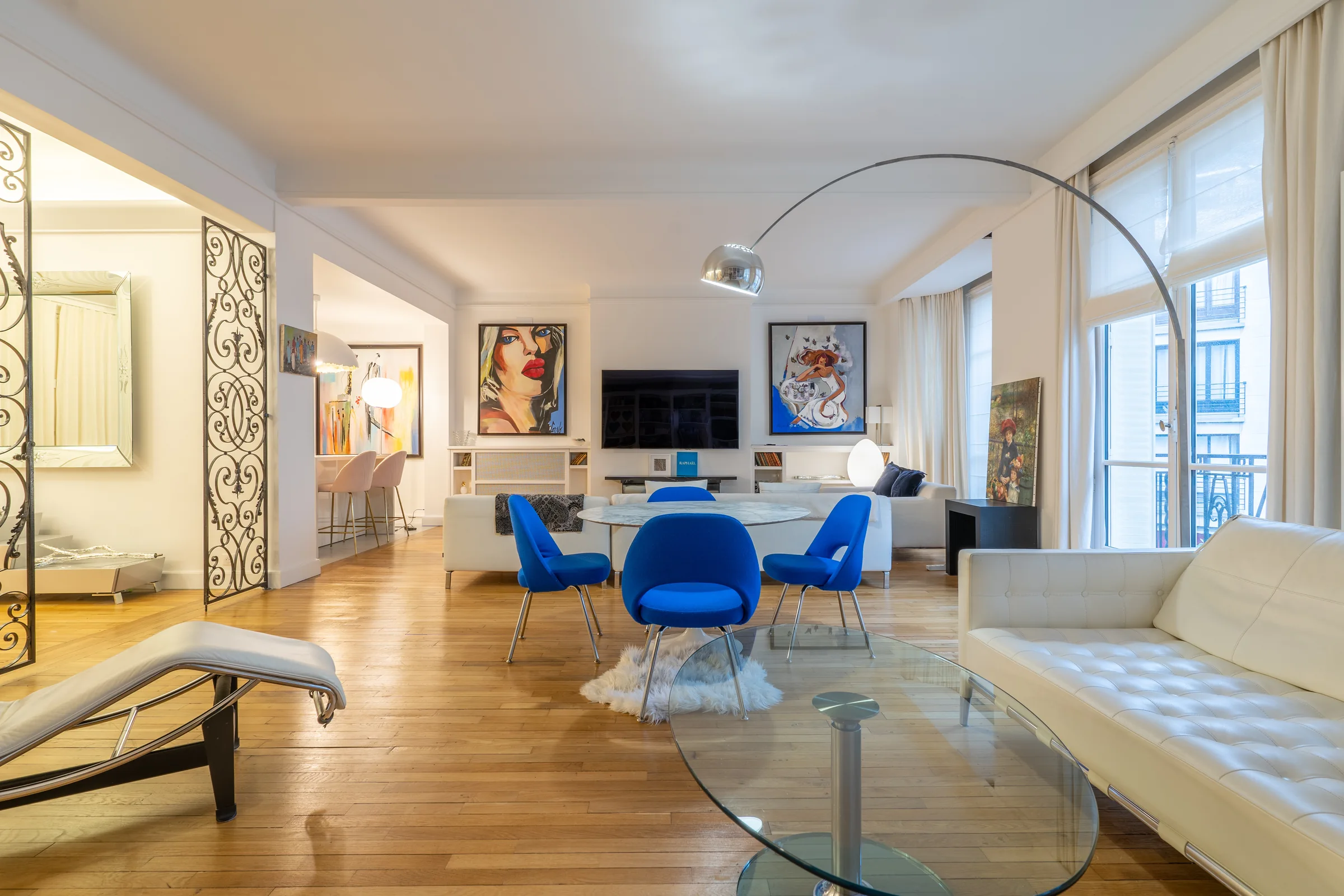 Classical Paris apartment with blue chairs — Paris, France. Photography by Yunes Calore.