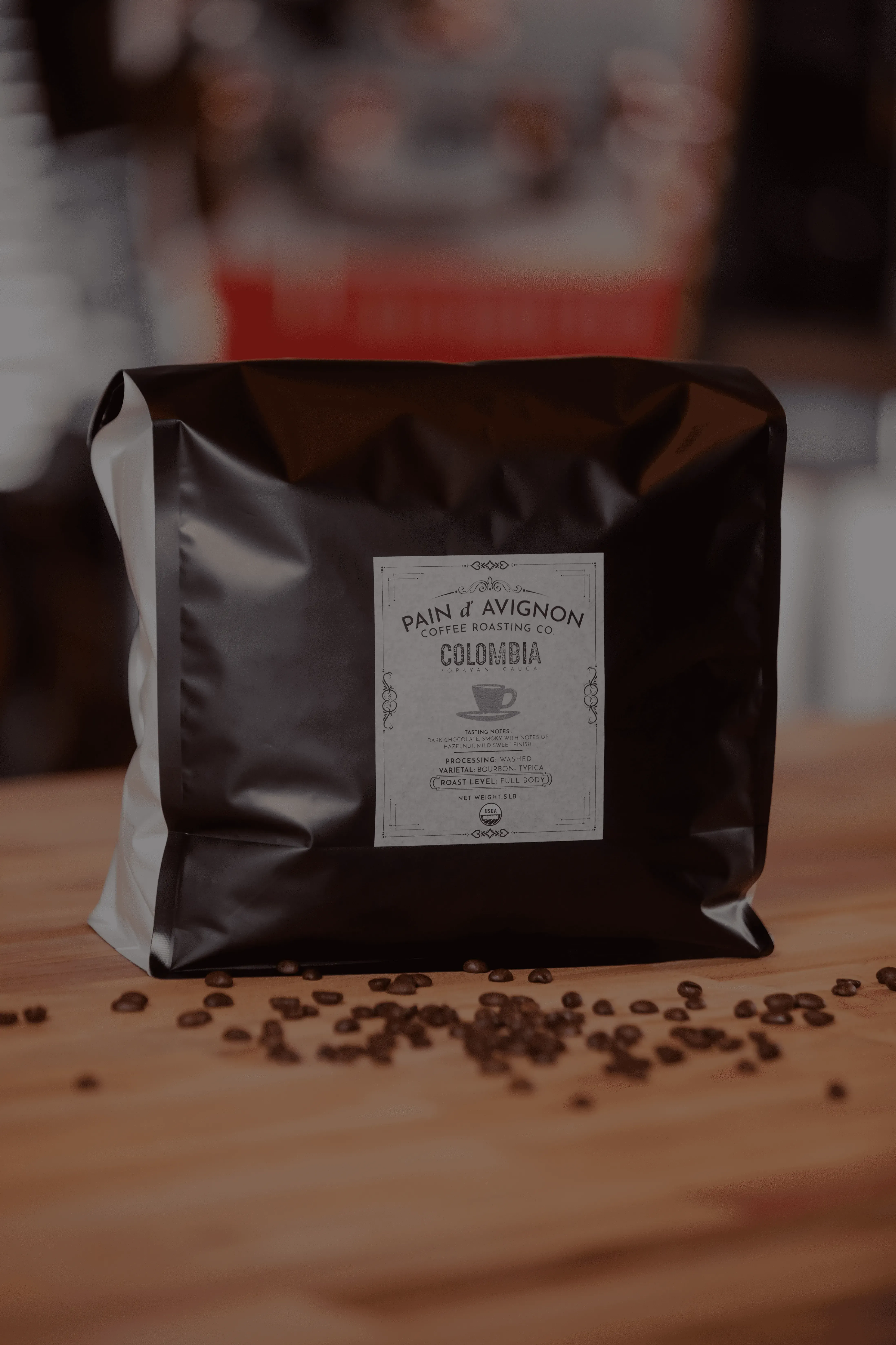 Pain d'Avignon Coffee Roasting Co. Colombia House blend — dark bag with branded label, filter roast with floral, citrus and berry notes