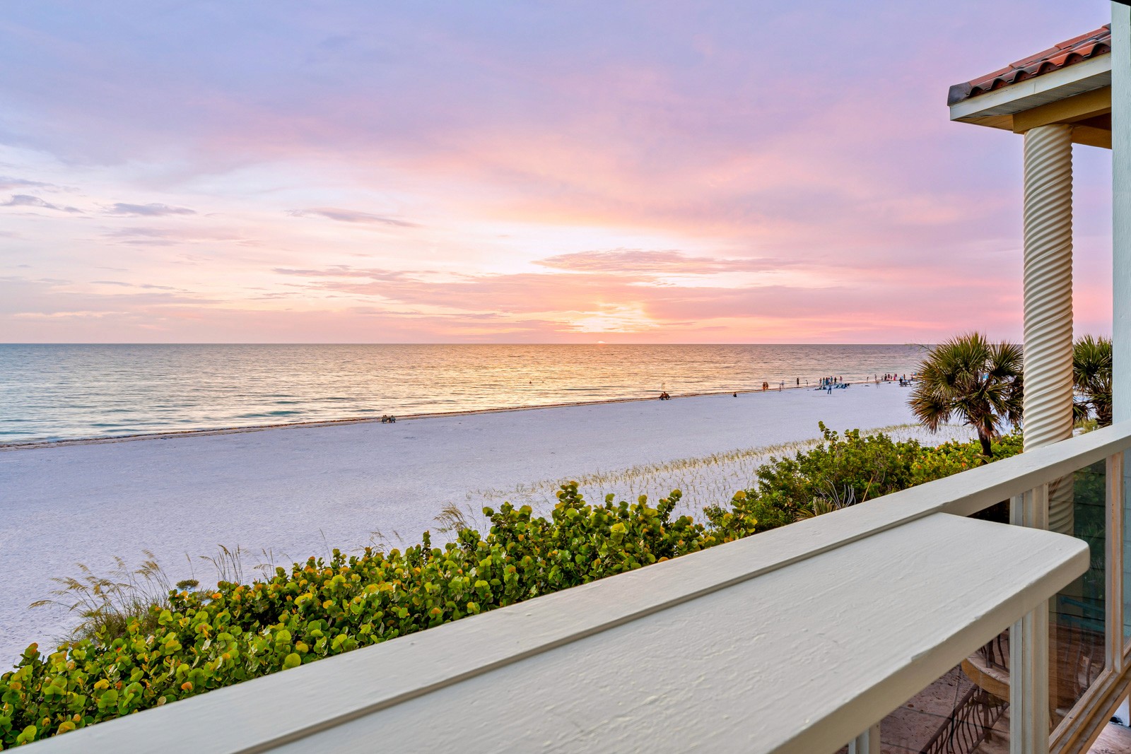 Balcony of a beachfront Airbnb with Gulf of Mexico sunset view, white sand beach and coastal greenery, from a Gator Gaze Media rental shoot in Indian Shores