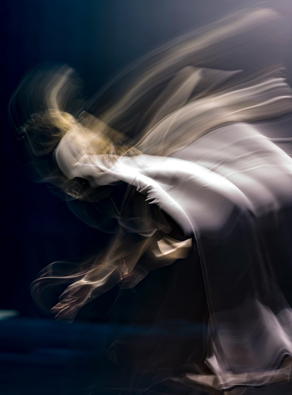 a blurry photo of a person doing a trick