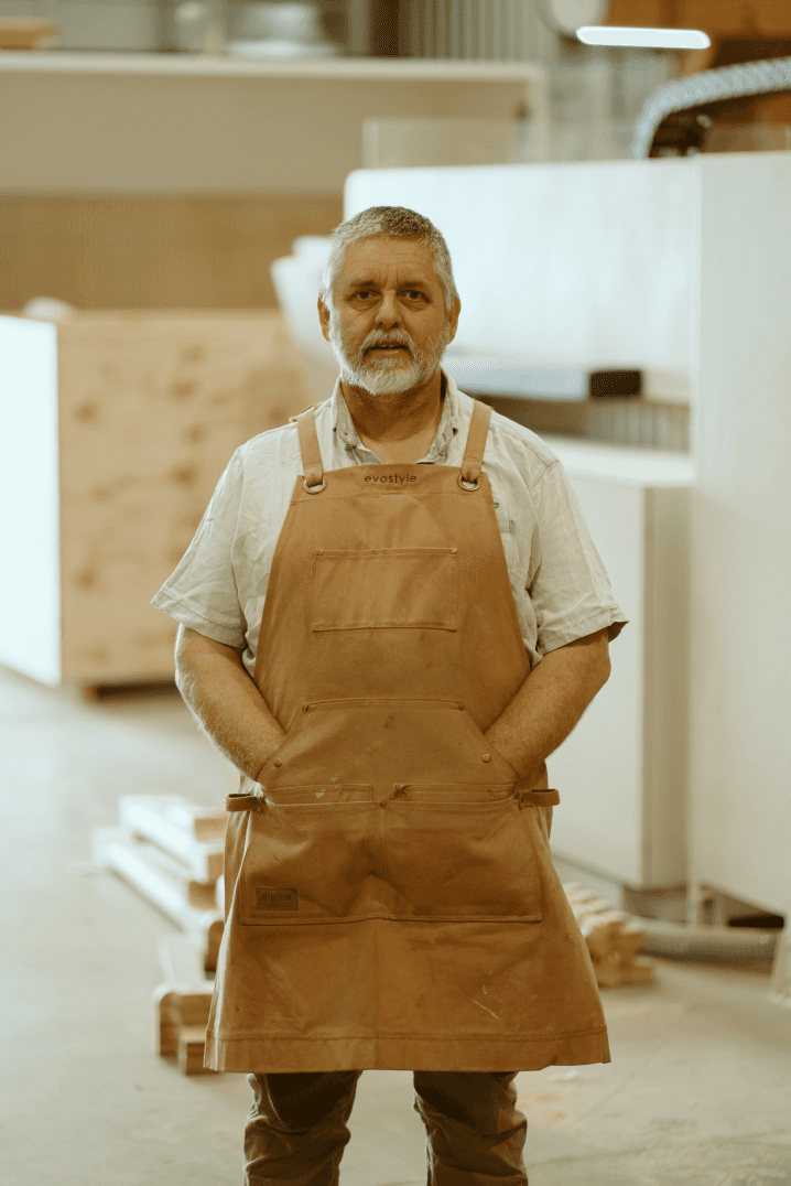 A fast black sports car races down the highway.