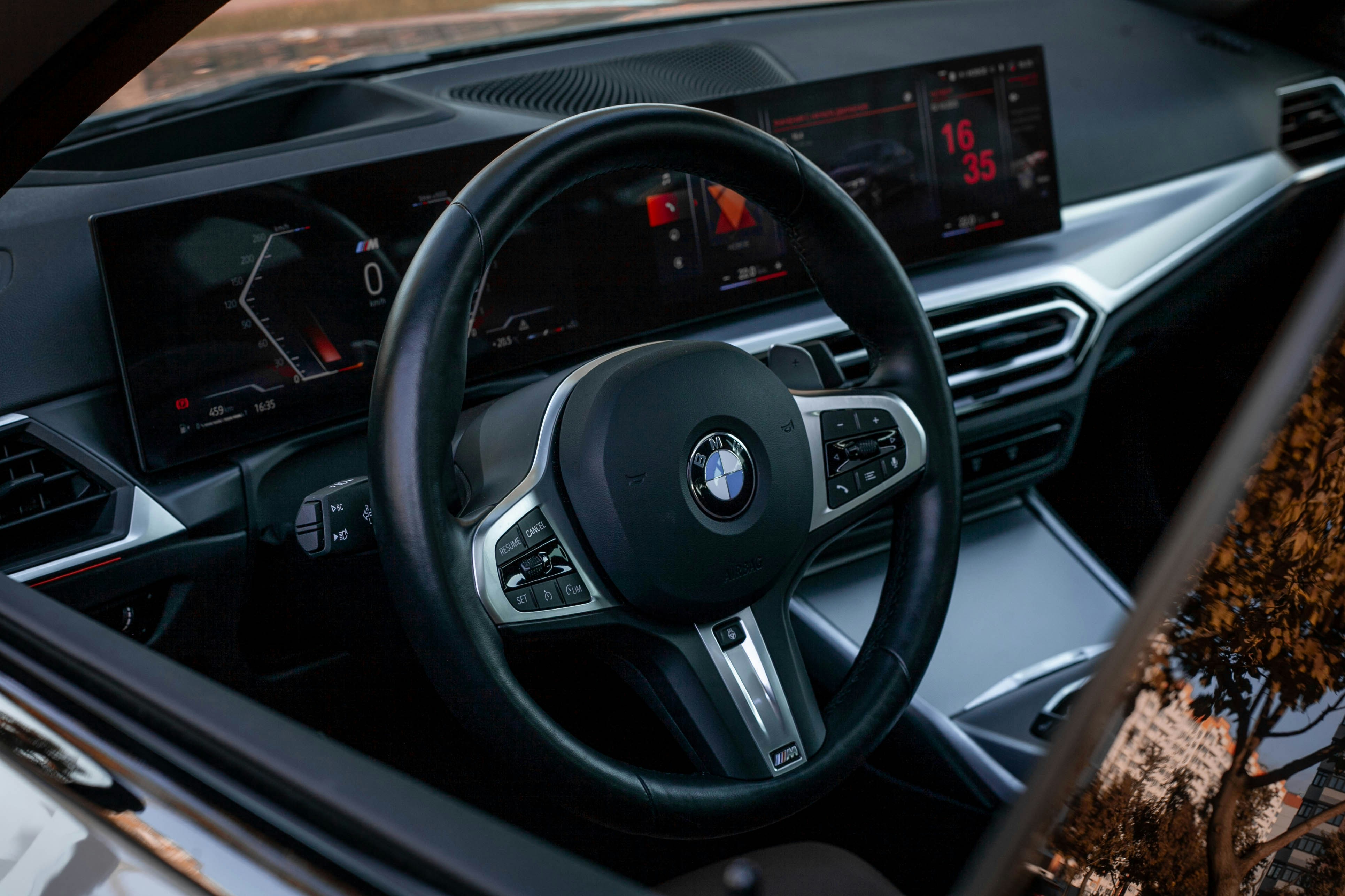Modern car interior with digital dashboard and steering wheel