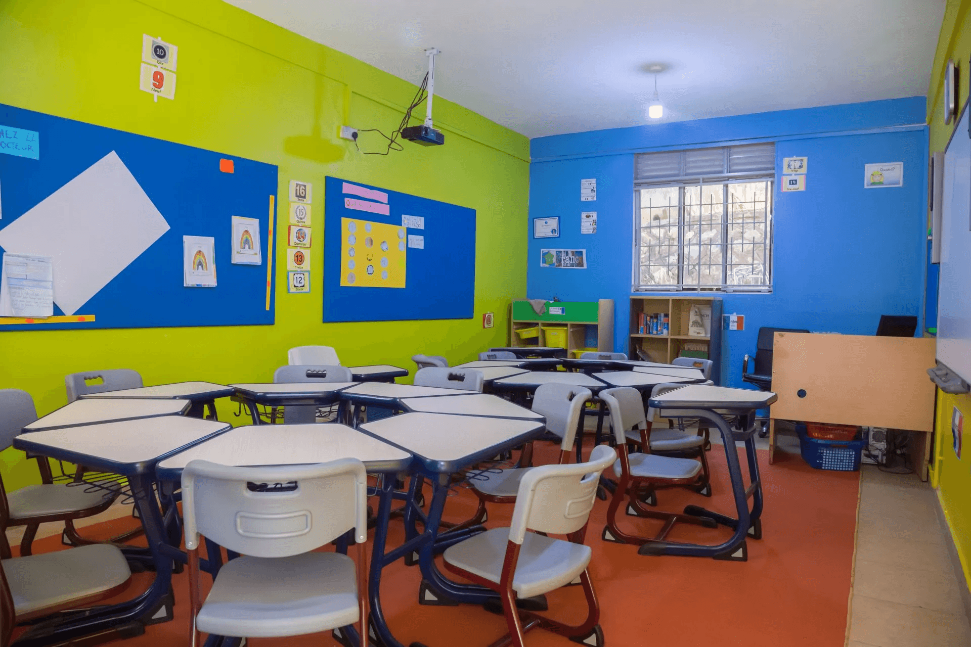 Two cheerful students are balancing books on their heads, smiling and laughing