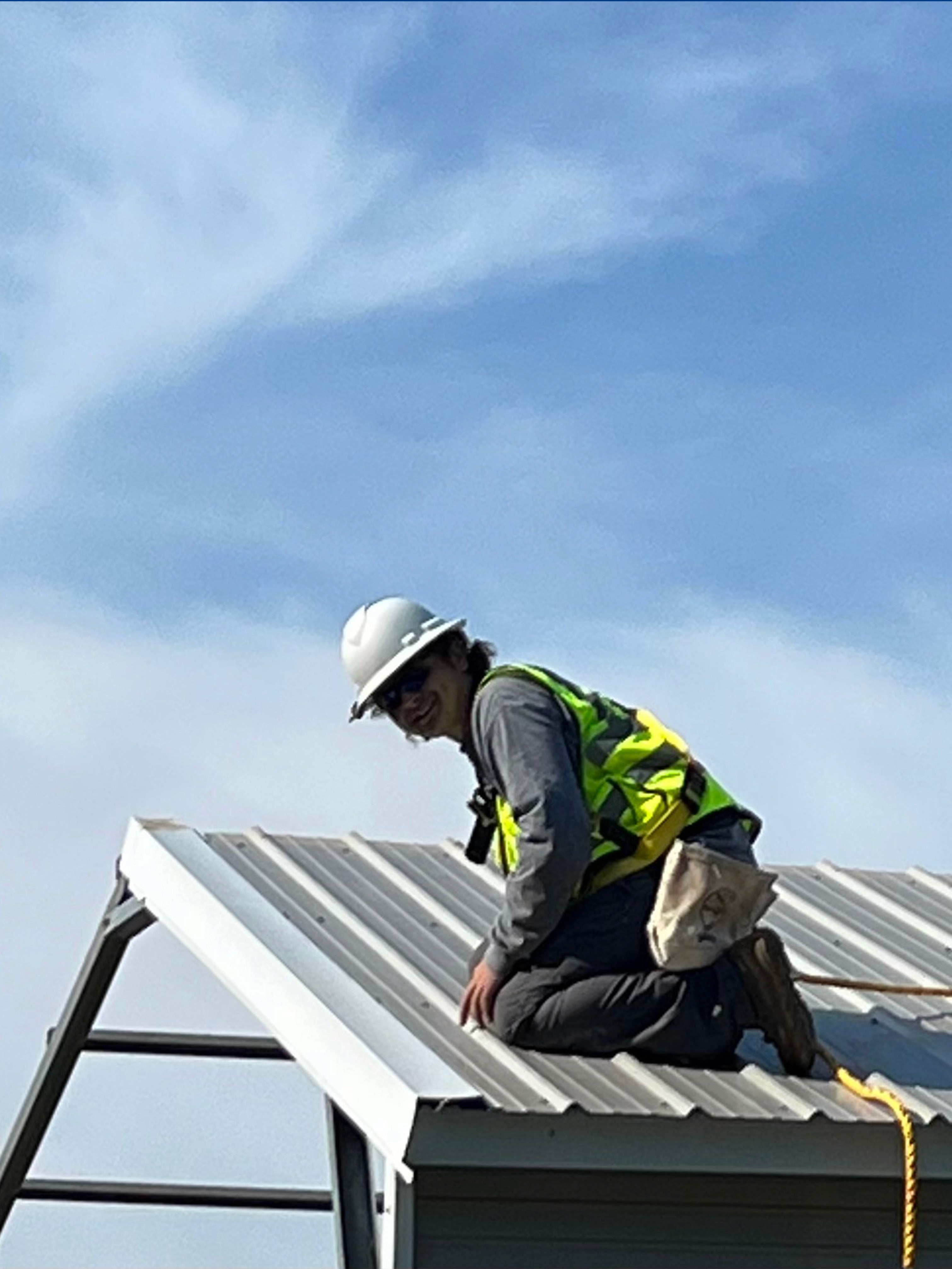 dlm constructors employee with safety equipment