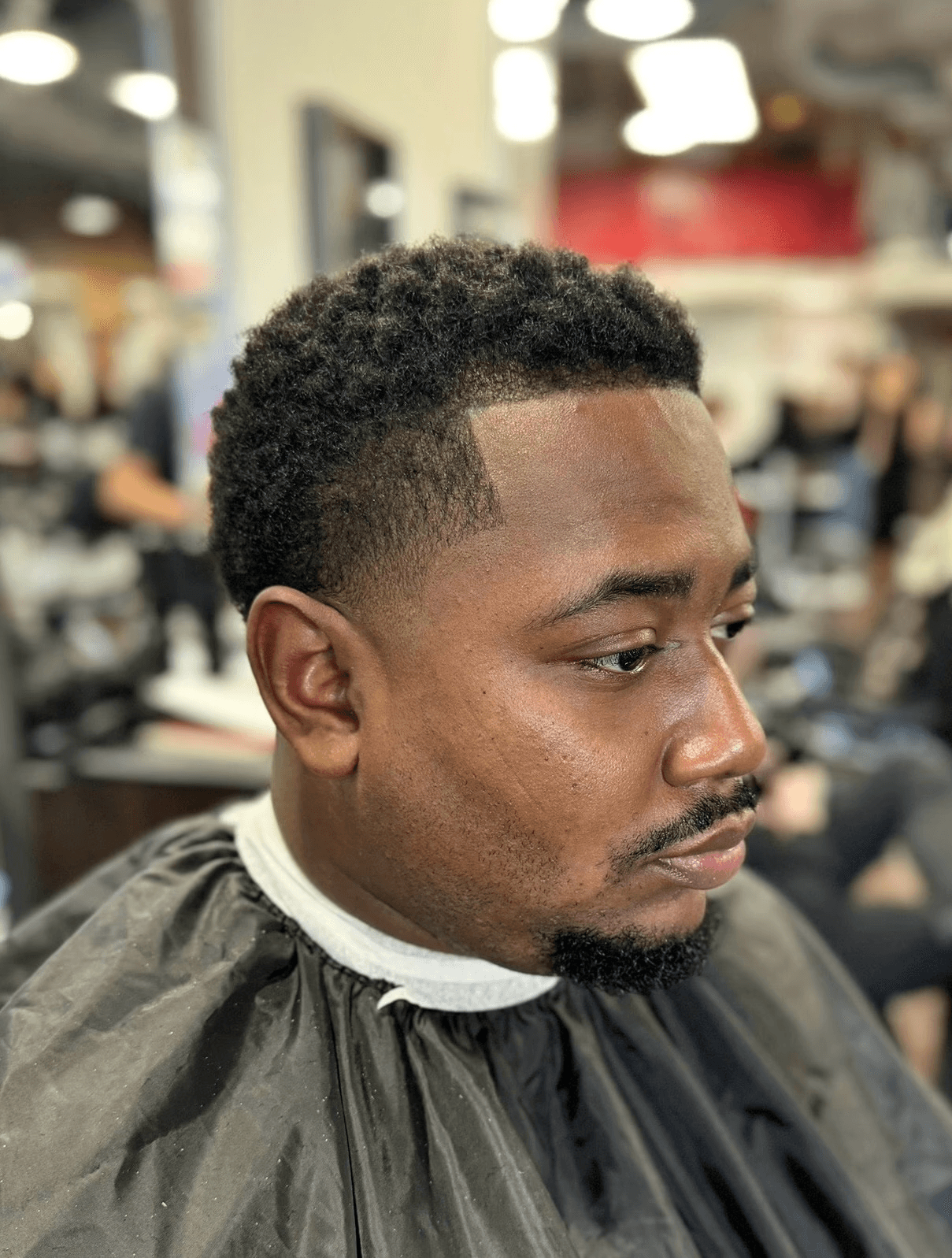 Natural textured taper fade for African American men, designed for a polished look.