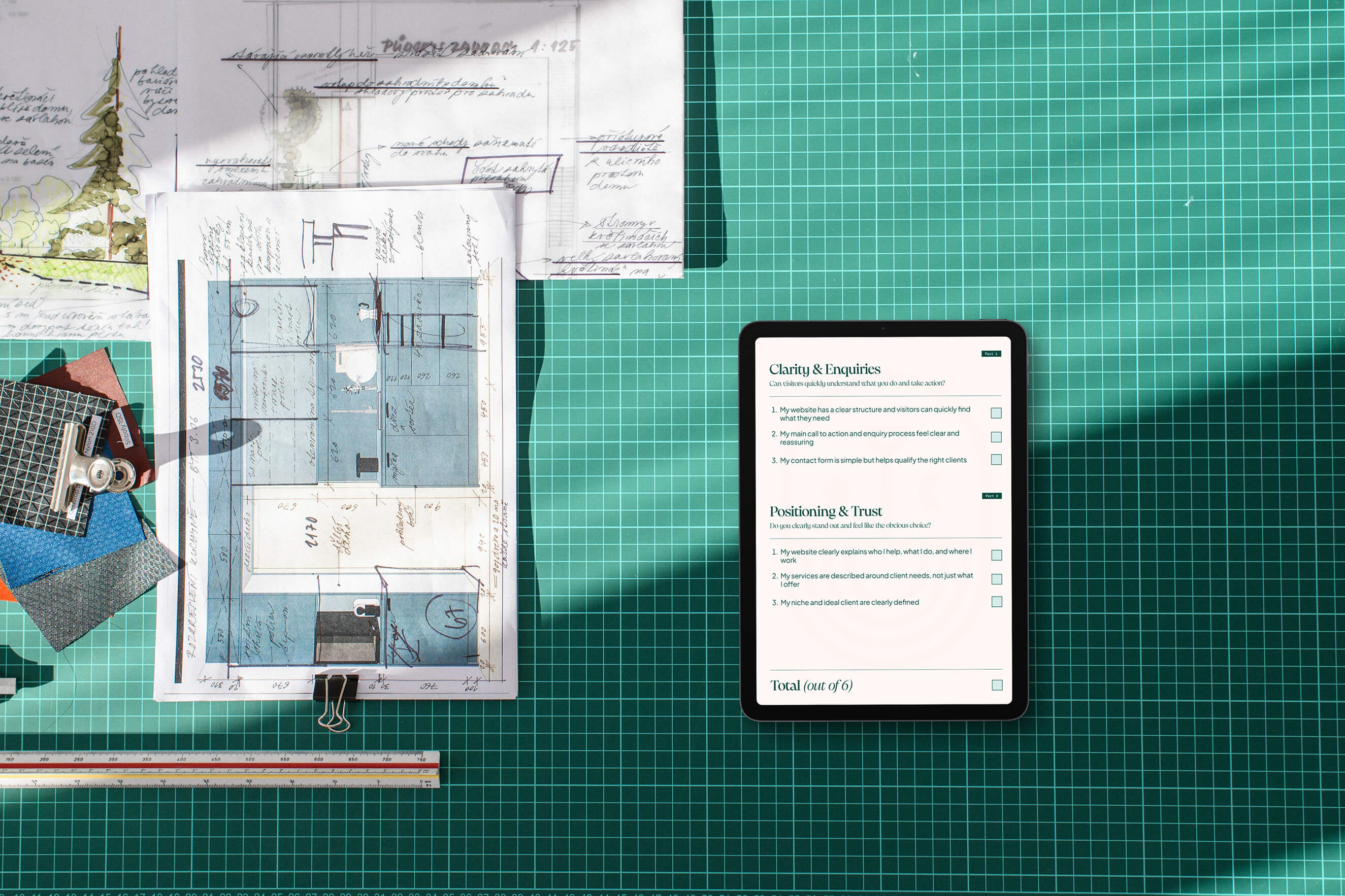 Architectural blueprint and digital checklist on a green grid desk background