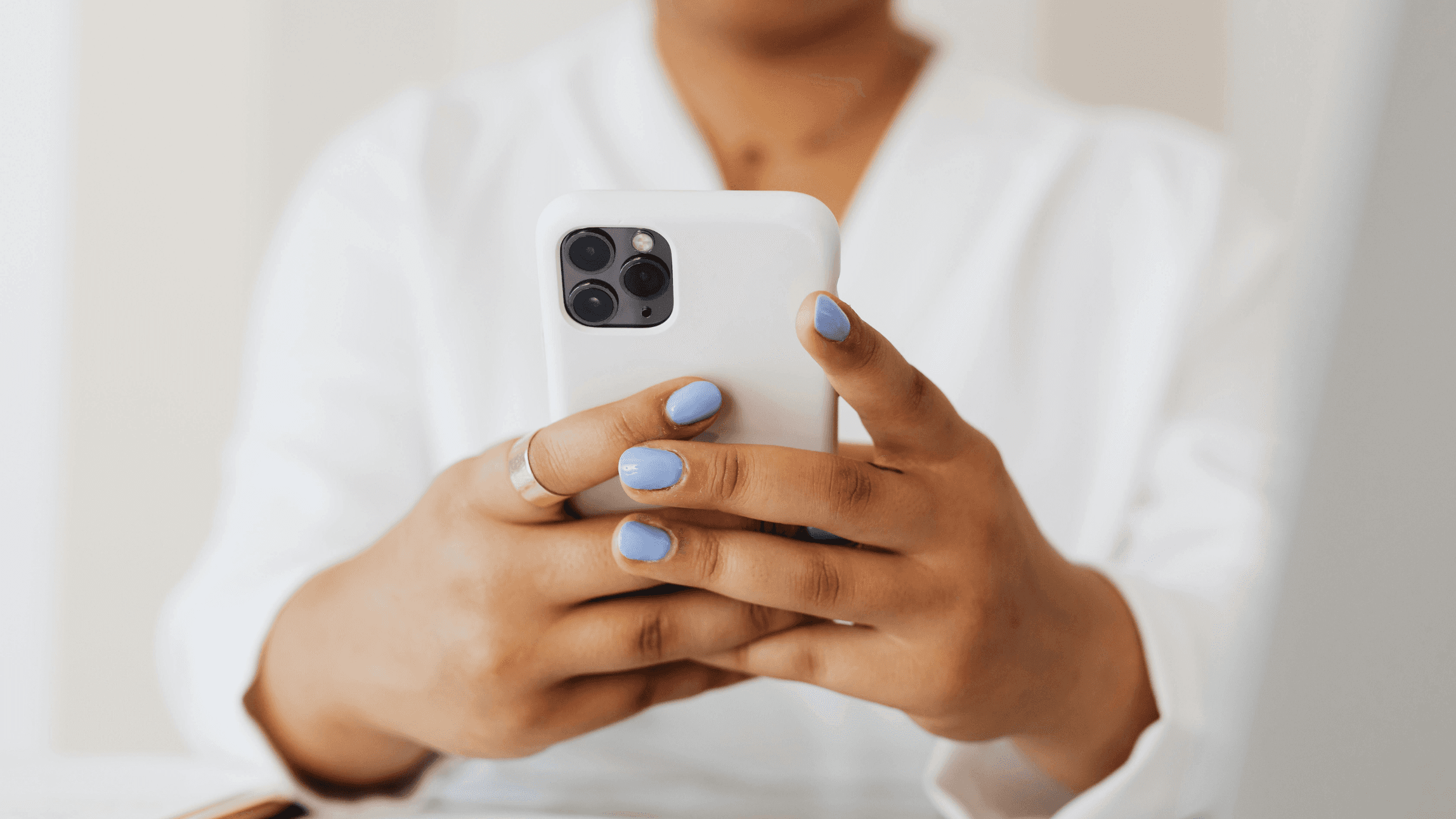 User operating a mobile device. Contact Funad Care Services