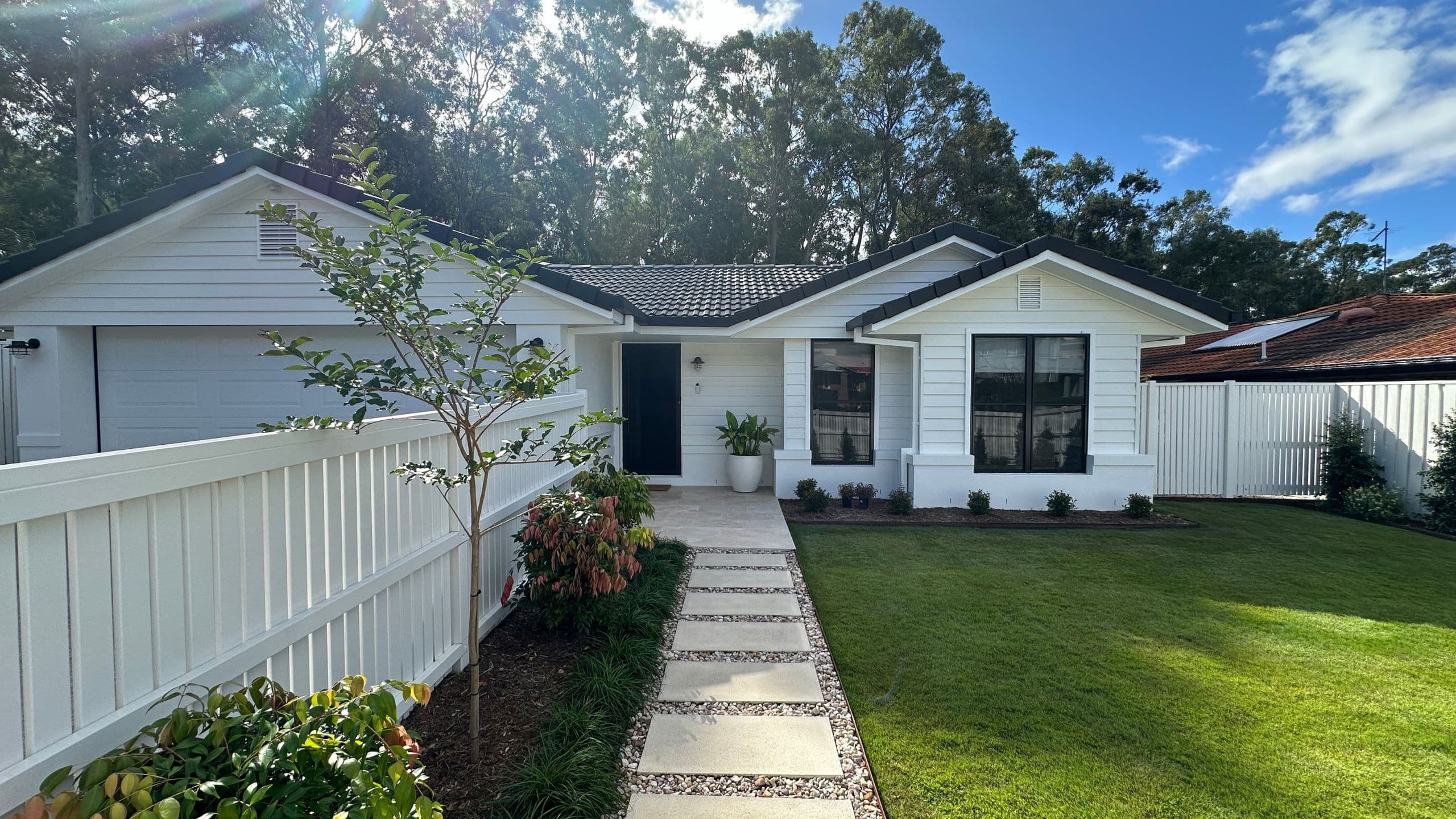 Renovated Brisbane home with modern design and landscaped front yard