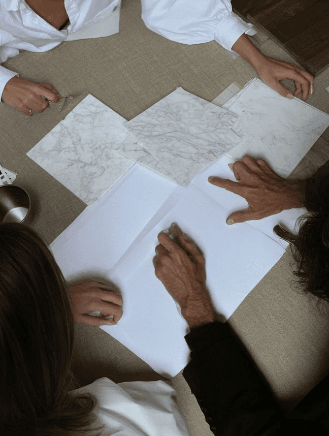 Two people reviewing architectural sketches together