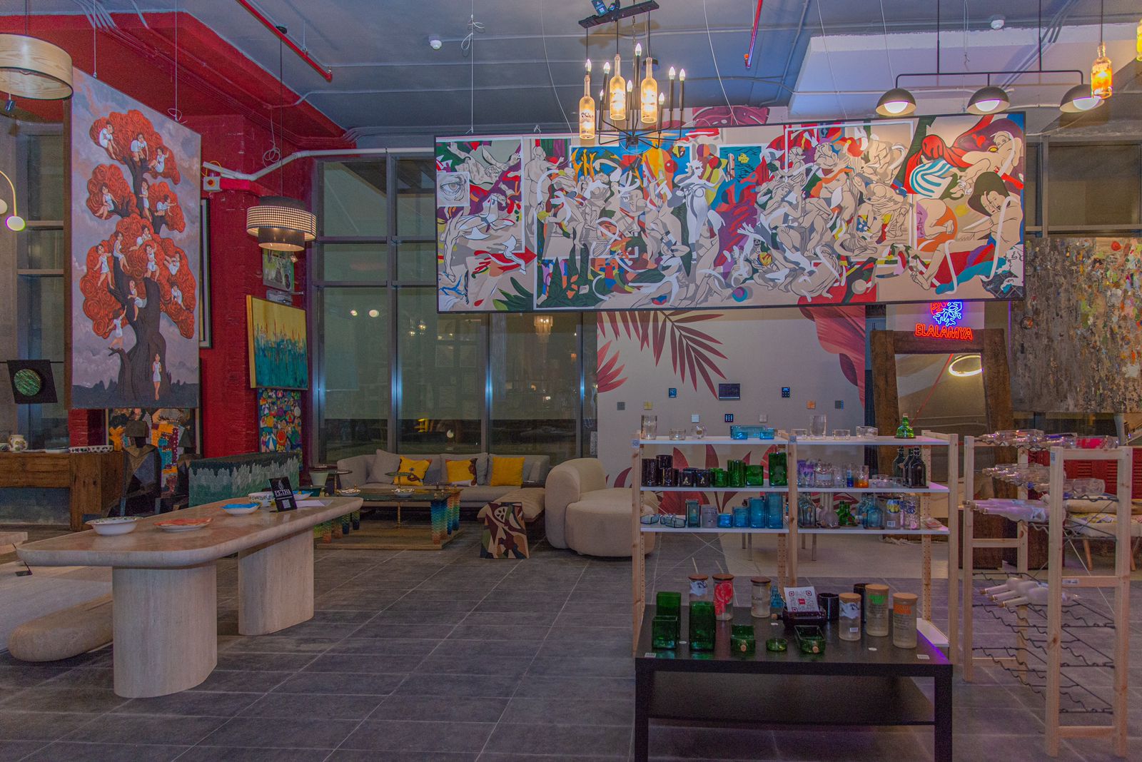 A flamingo stands in shallow water with reflection