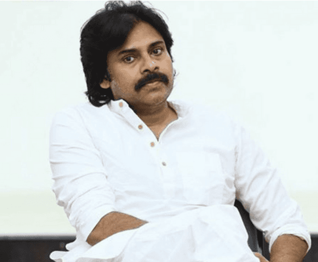 Several glowing blue jellyfish swim in dark water.