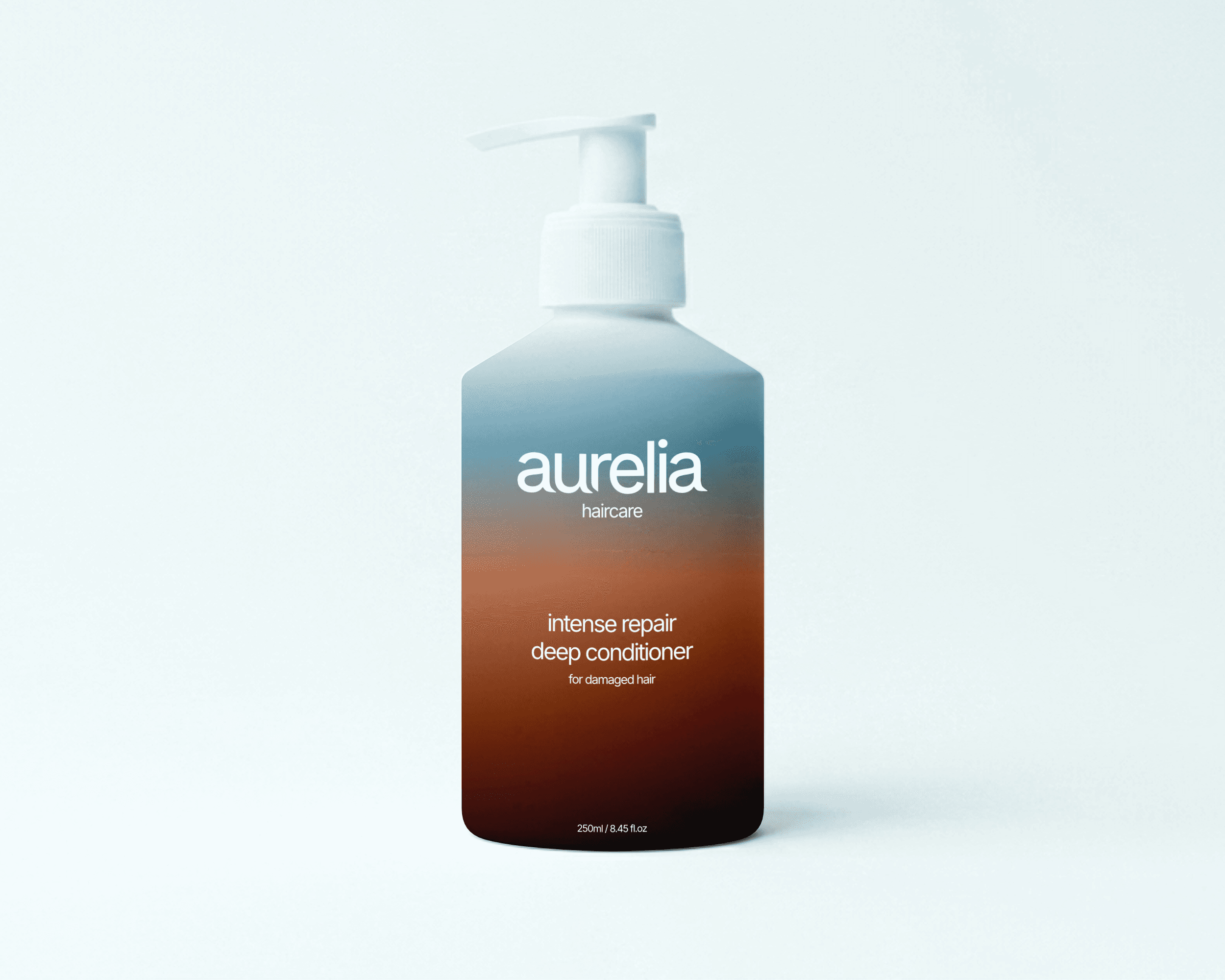 An Aurelia Haircare packaging design bottle. The bottle features a simple design with a blue and brown gradient.