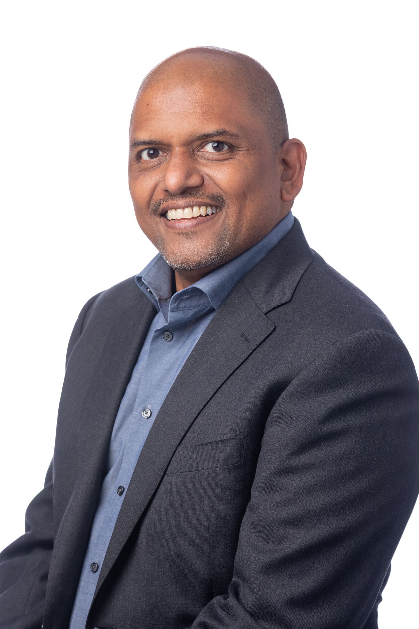 A black and white headshot of Ravi Chandra