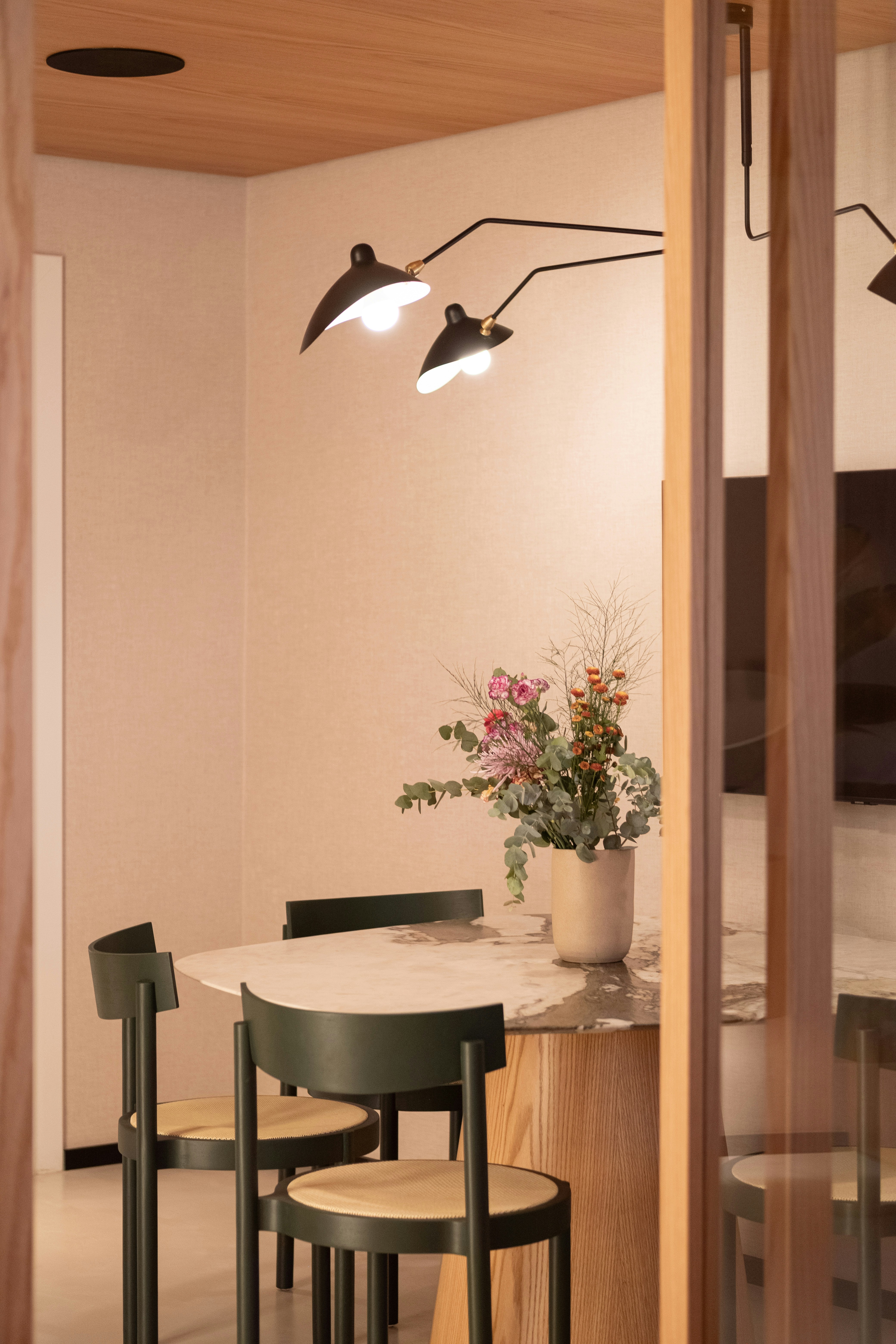 Dining table with chairs and floral centerpiece