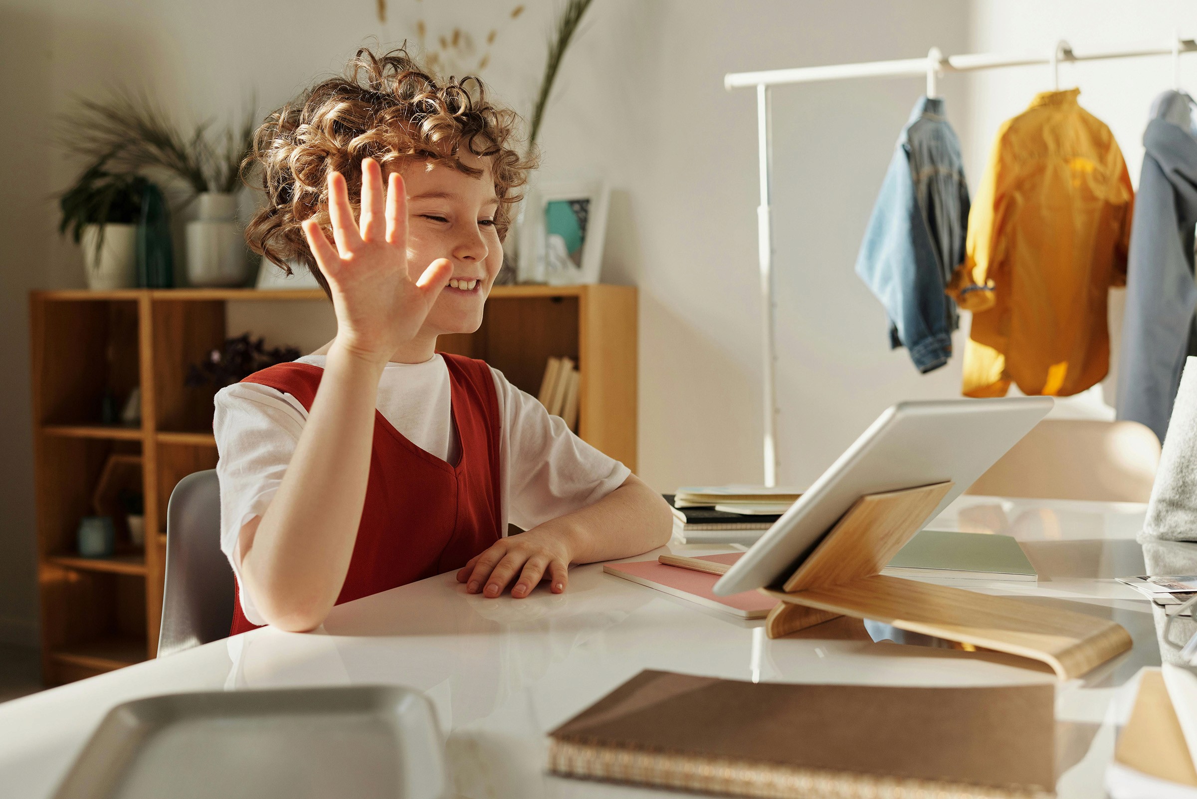 A happy student is on a video call, smiling and engaged