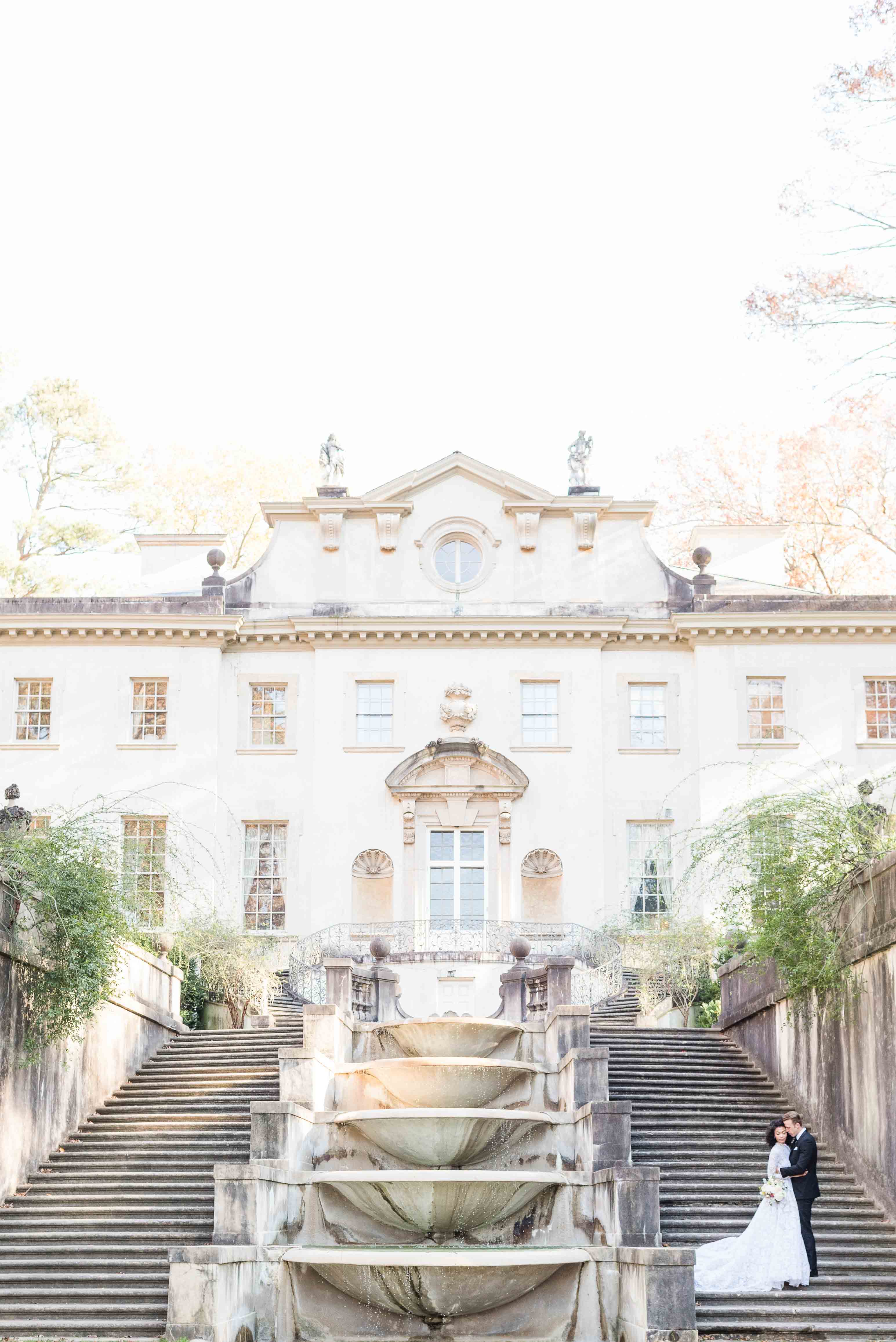 Bride and groom in front of historic Swan House in Atlanta, Georgia.