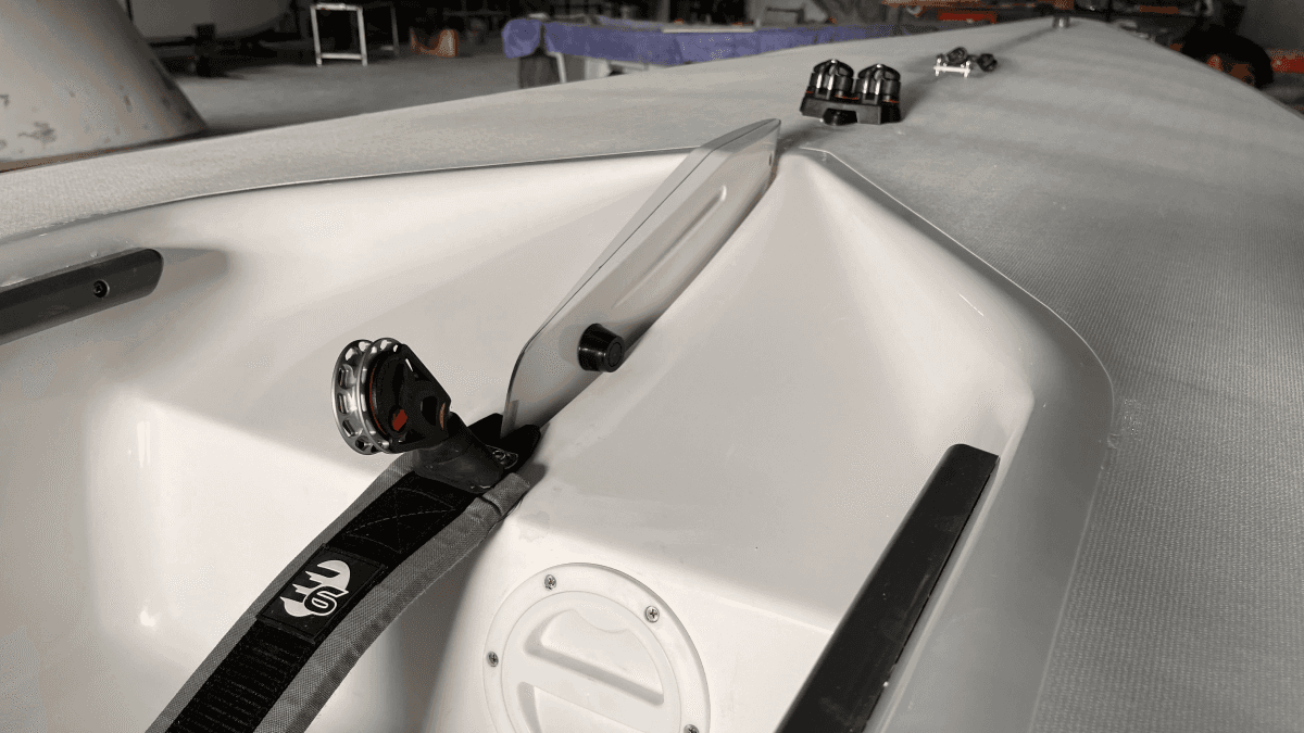 a person swimming in the water with grass