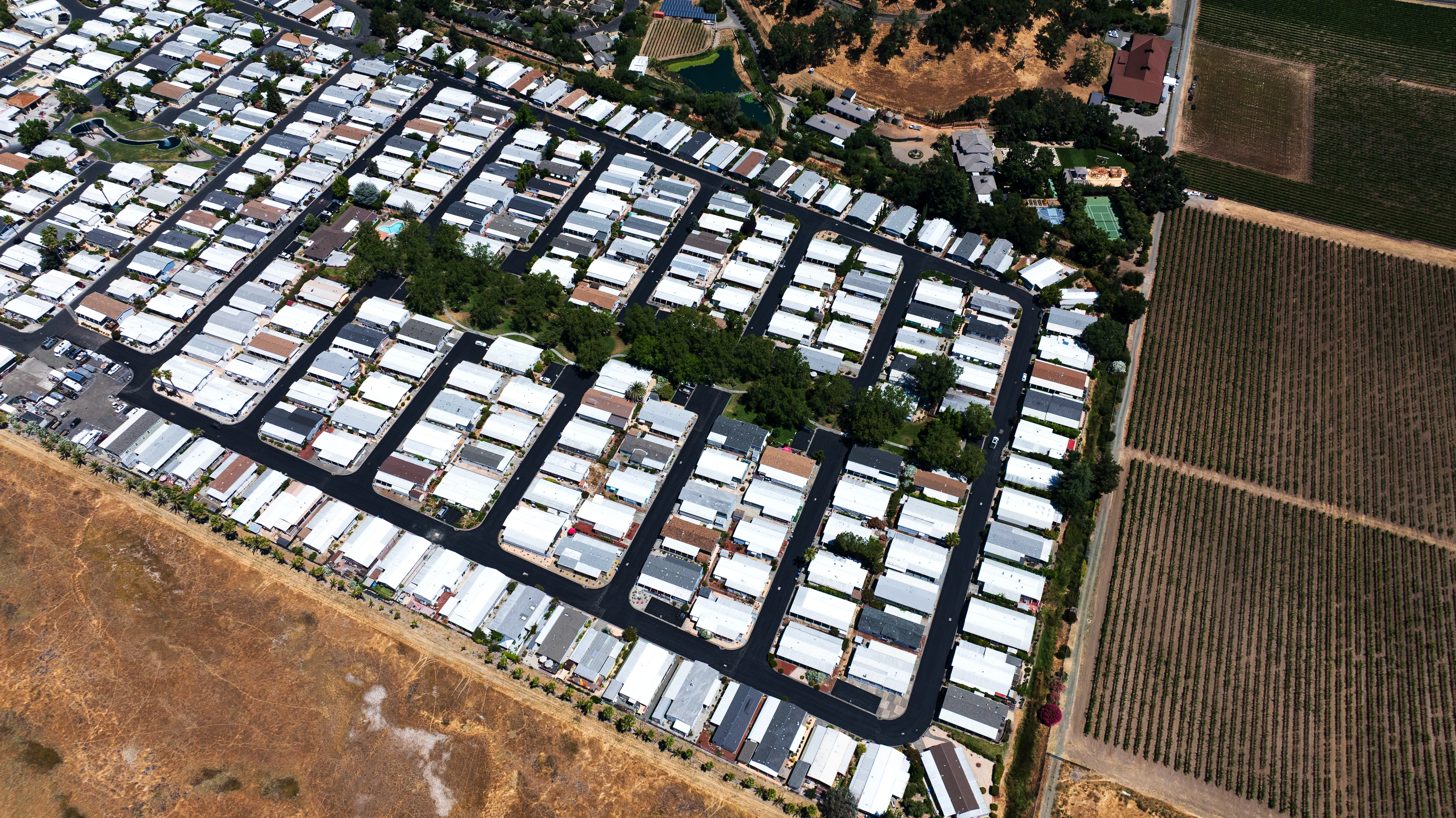 Drone photo of freshly seal-coated mobile home park streets