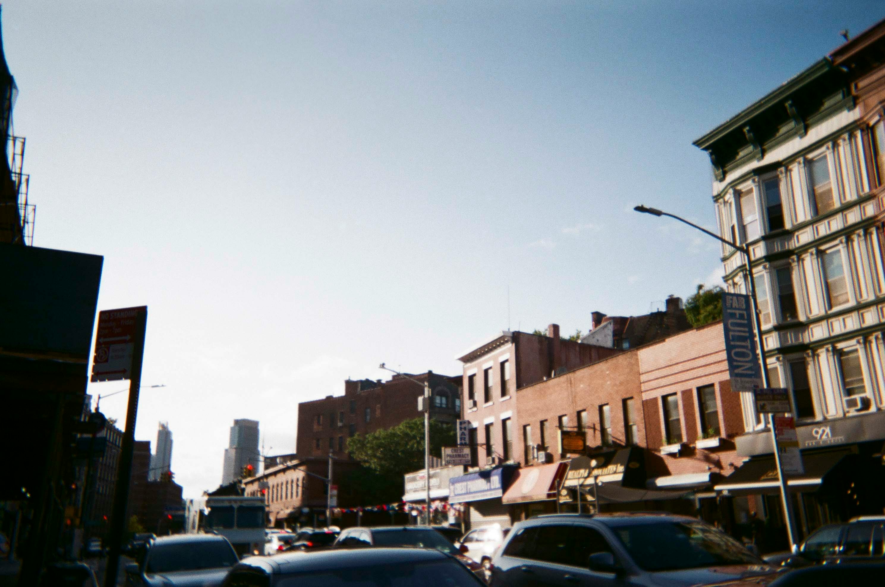 cars parked on side of the road during daytime