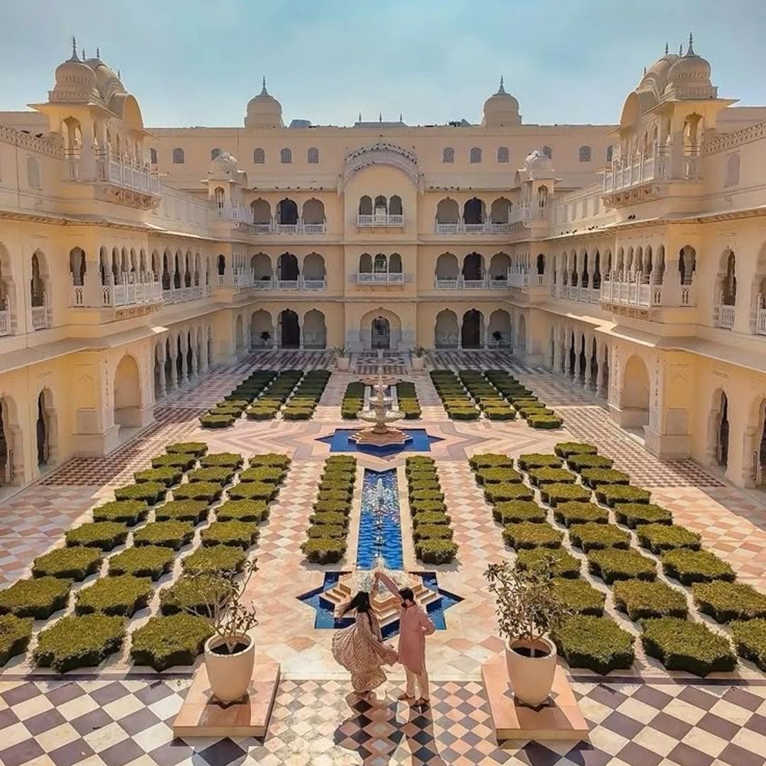 The wedding backdrop is the open sea, shimmering under late afternoon light