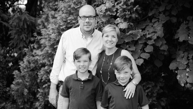 man filming on beach