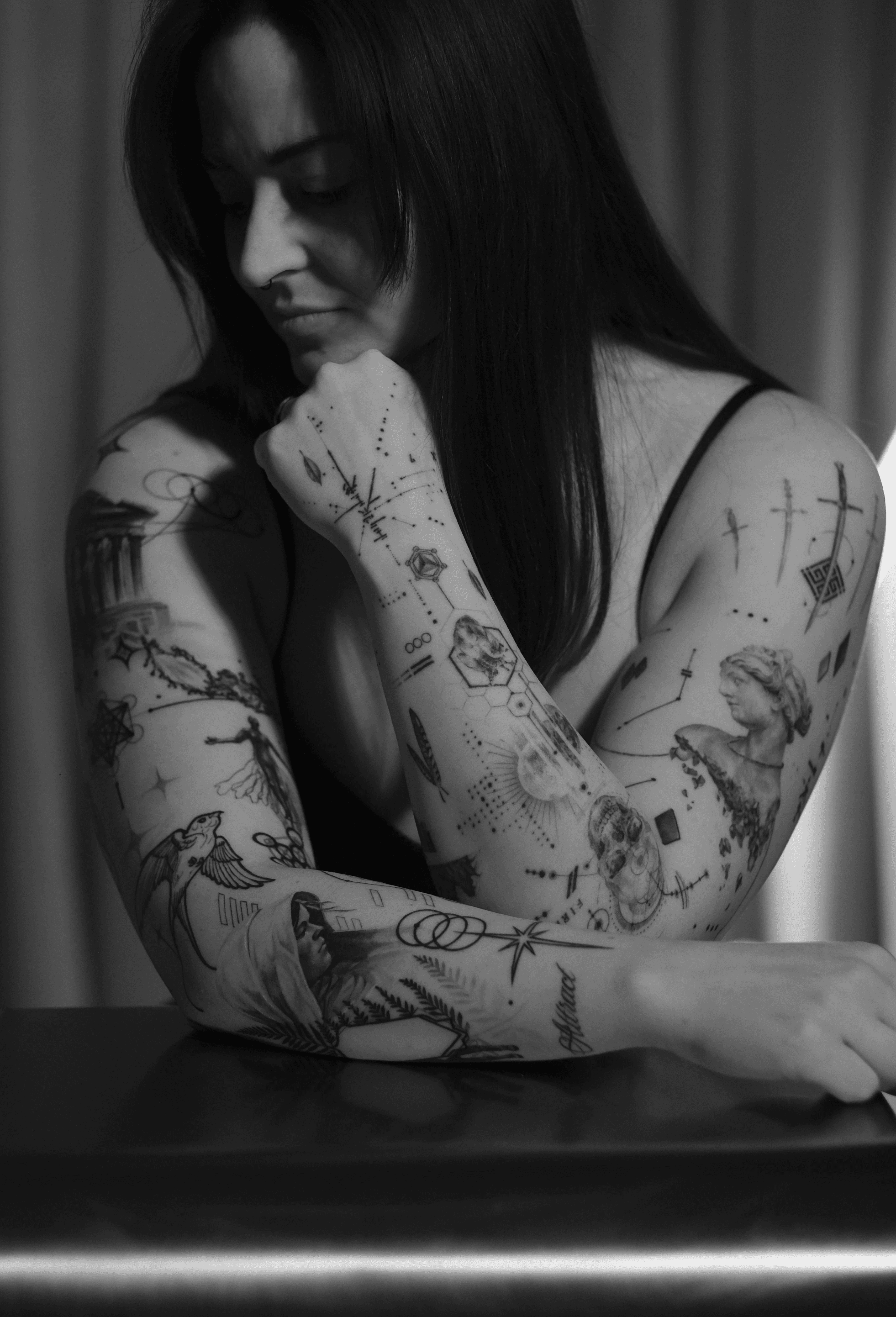 A modern gallery space with a geometric abstract painting on a white wall