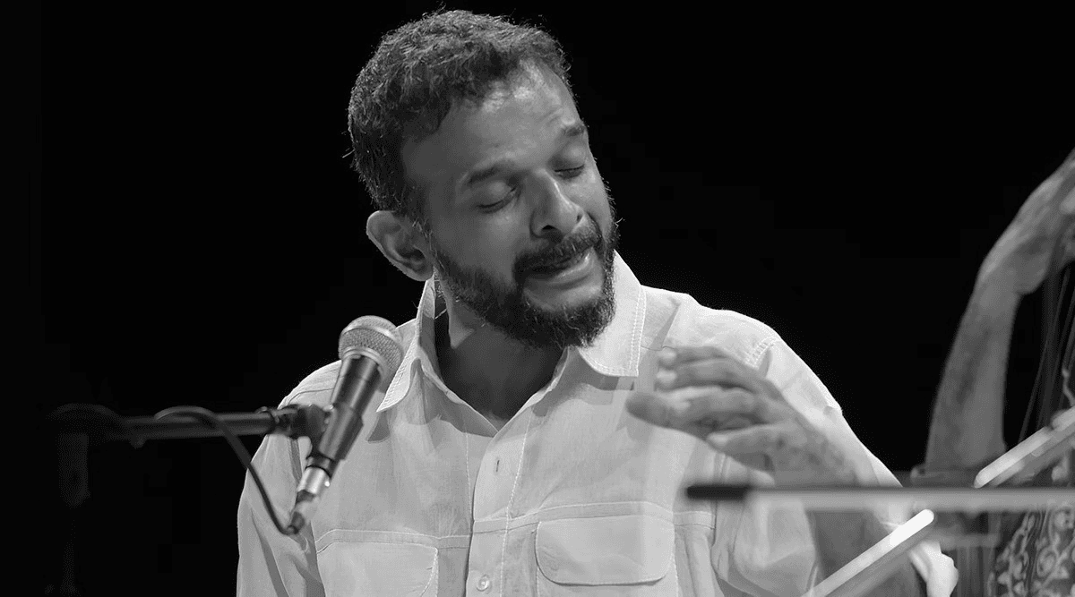 person playing audio mixer in concert