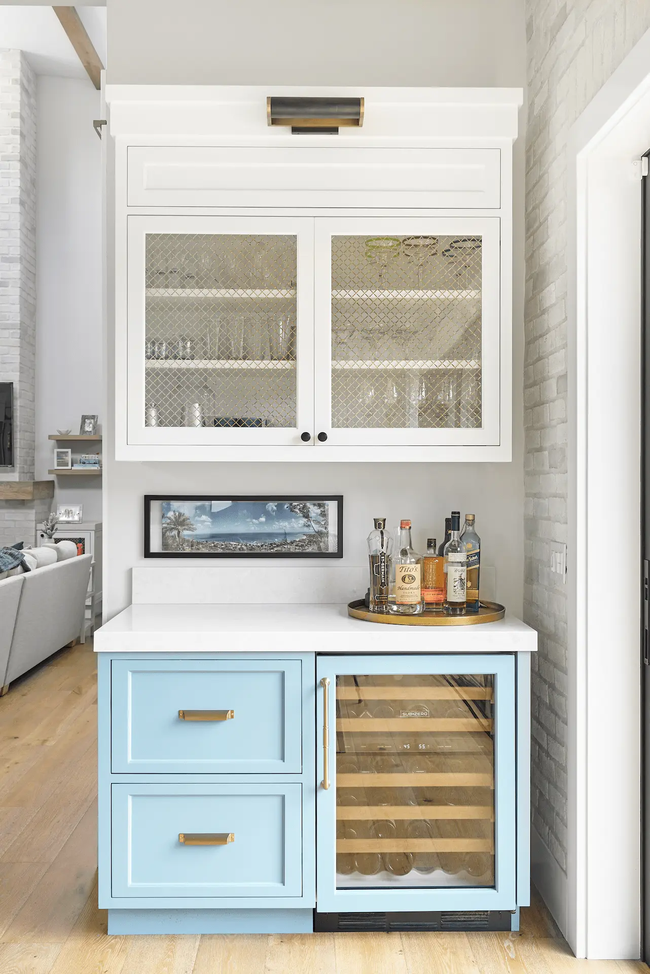 Chic kitchen coffee bar with blue cabinetry and wine storage in North Tustin Remodel & Addition. Photo by Todd Huge.