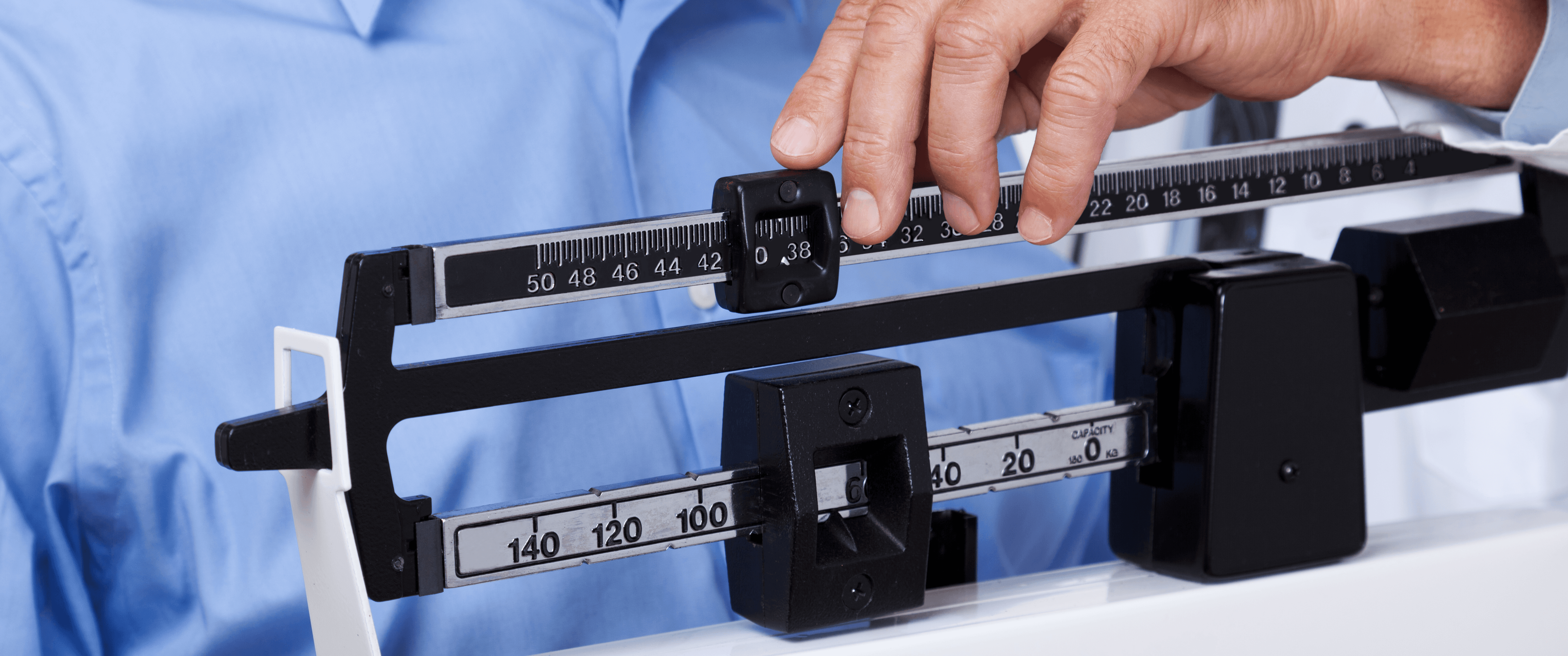 Patient weighing themselves on balance scale - Can I Ask My Doctor for Weight Loss Medication