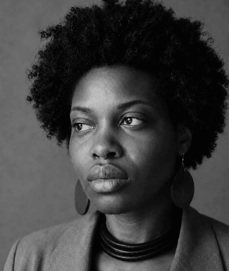 Black and white portrait of founder behind Inou Designs