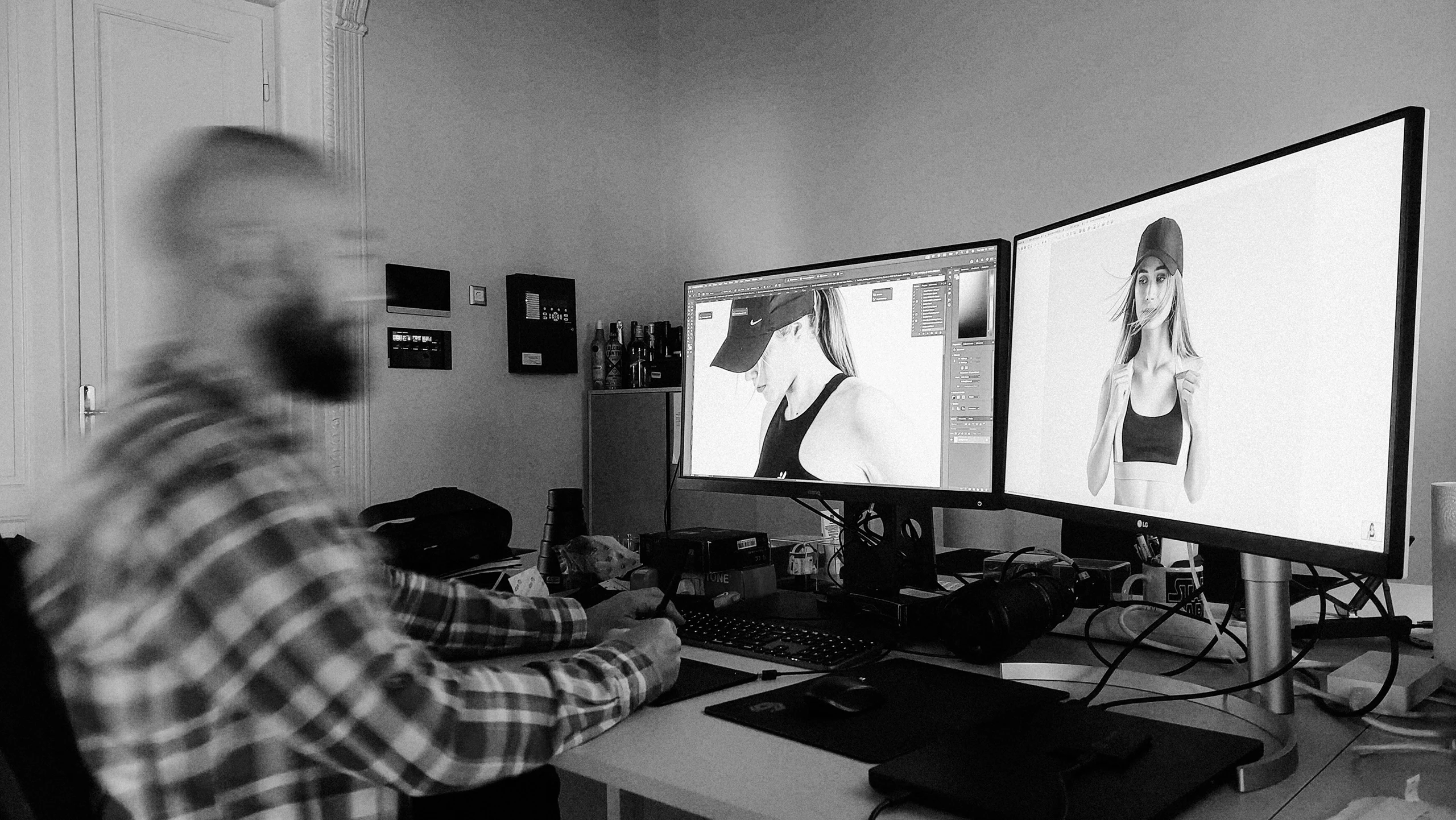 Photographer retouching photos on a computer in his studio office