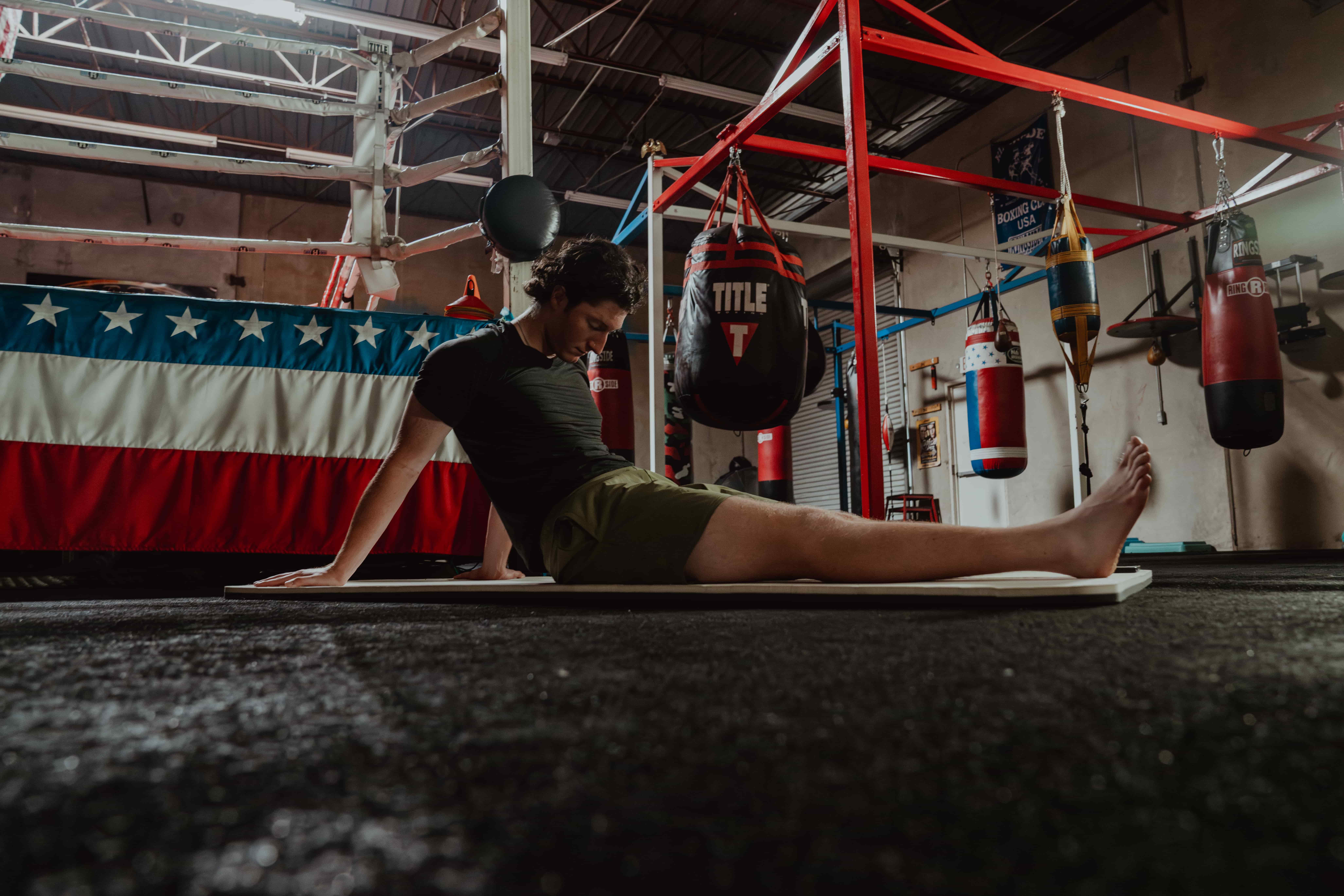 Man Stretching his Back - Back Mobility Exercises