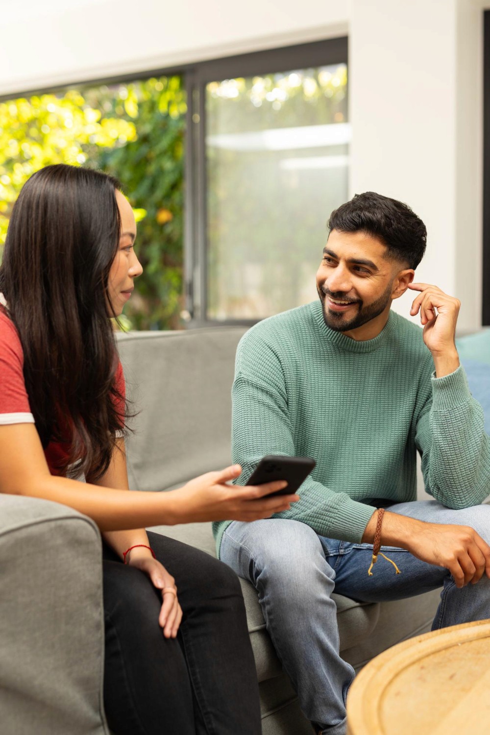 Therapist sitting and talking with a client during an indoor counselling session.