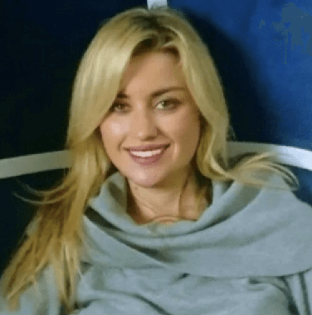 woman in black long sleeve shirt sitting on white couch