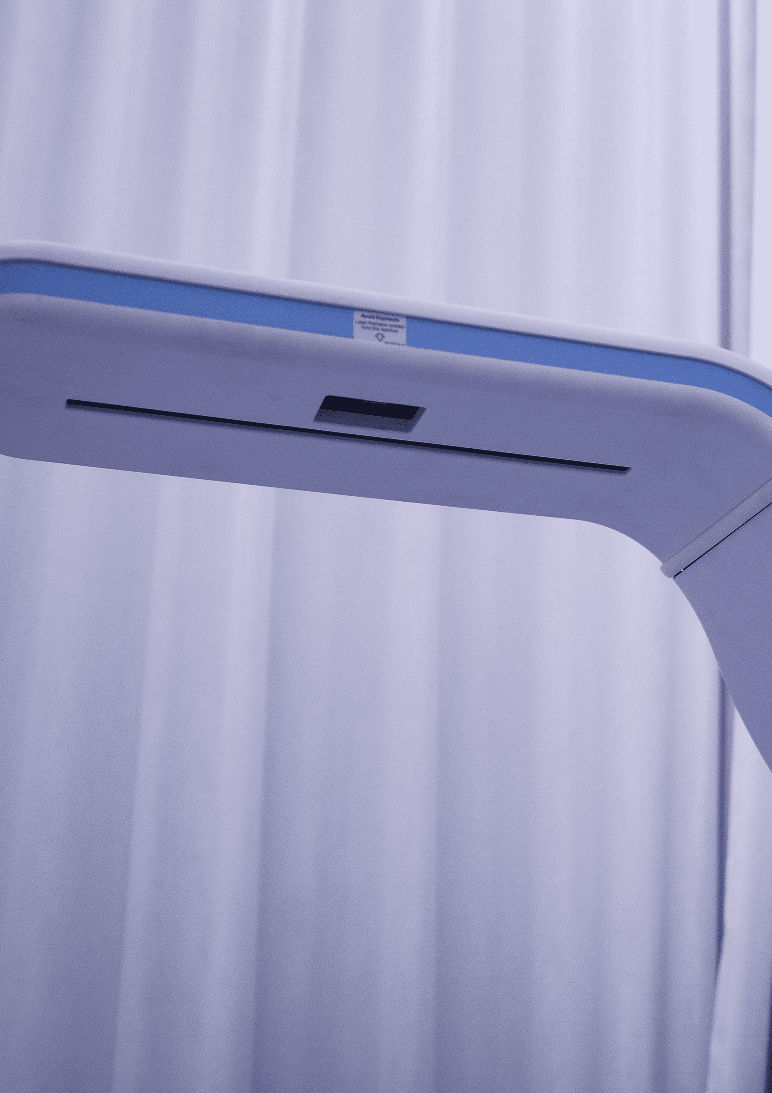 Rachel, personal trainer, looking to the side confidently in a fitness studio