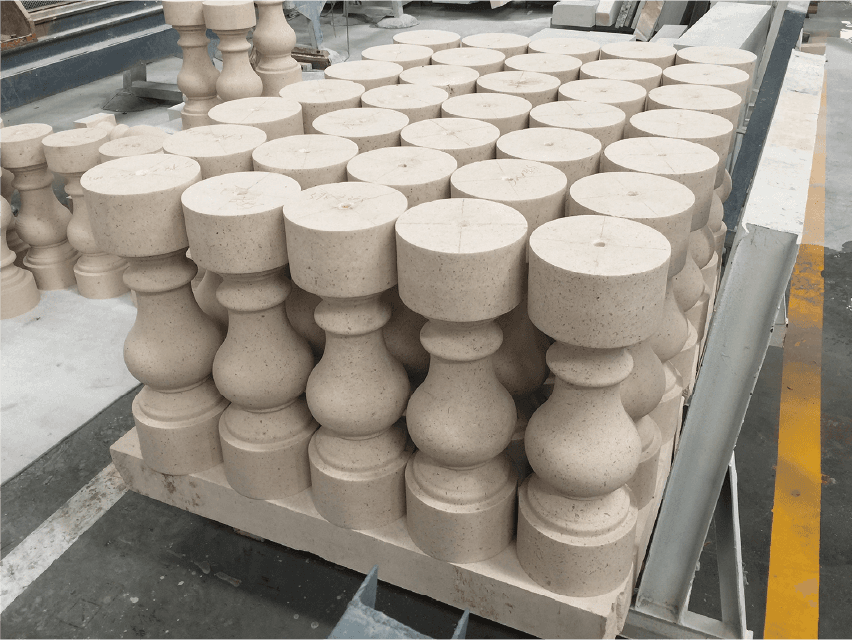 A large quantity of stone balusters produced by the Bridge-type Bidirectional Cuts Machine, demonstrating the machine's efficiency in bulk production.