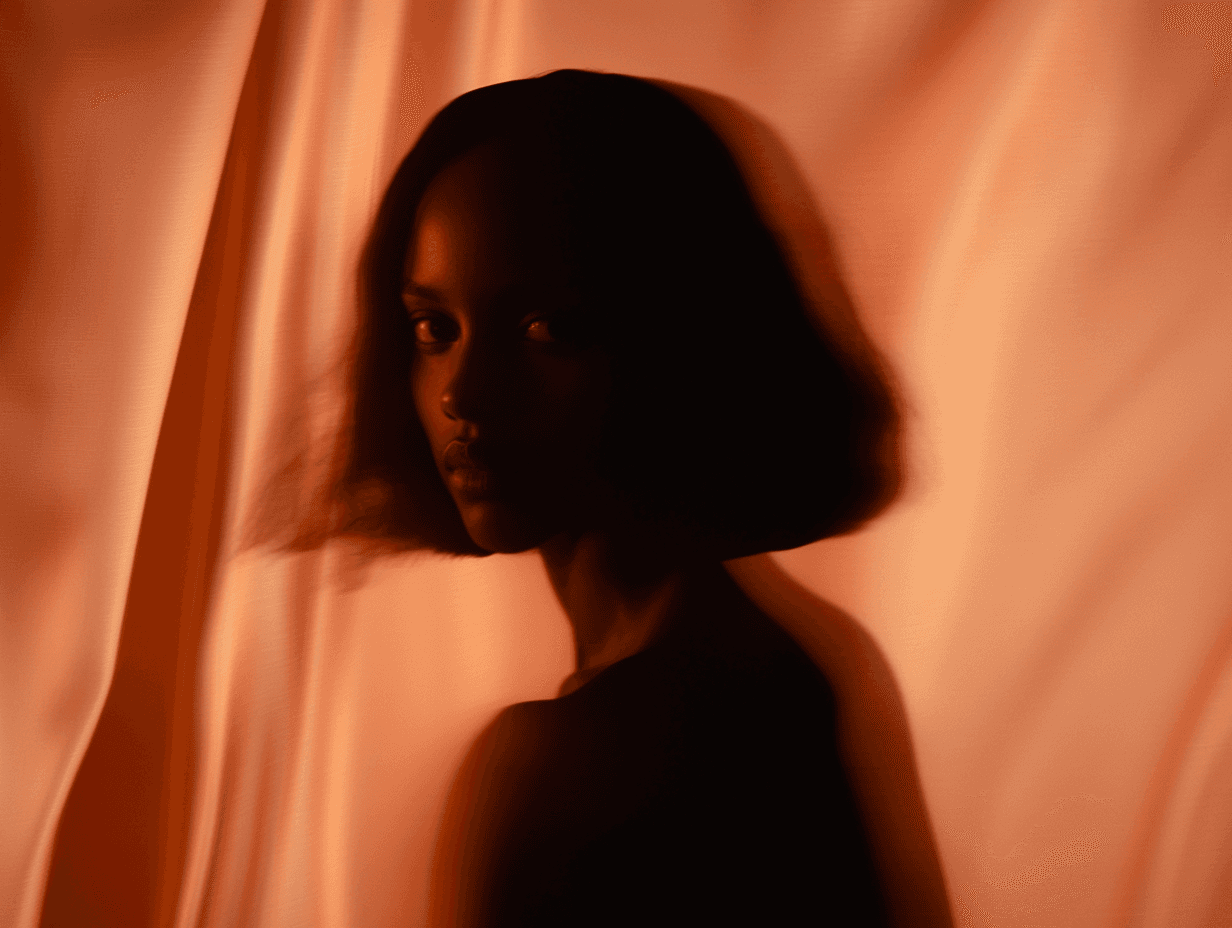 Portrait shot of a woman against a dark brown silk background