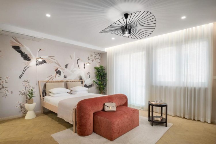 sunloungers fronting buildings near mountain