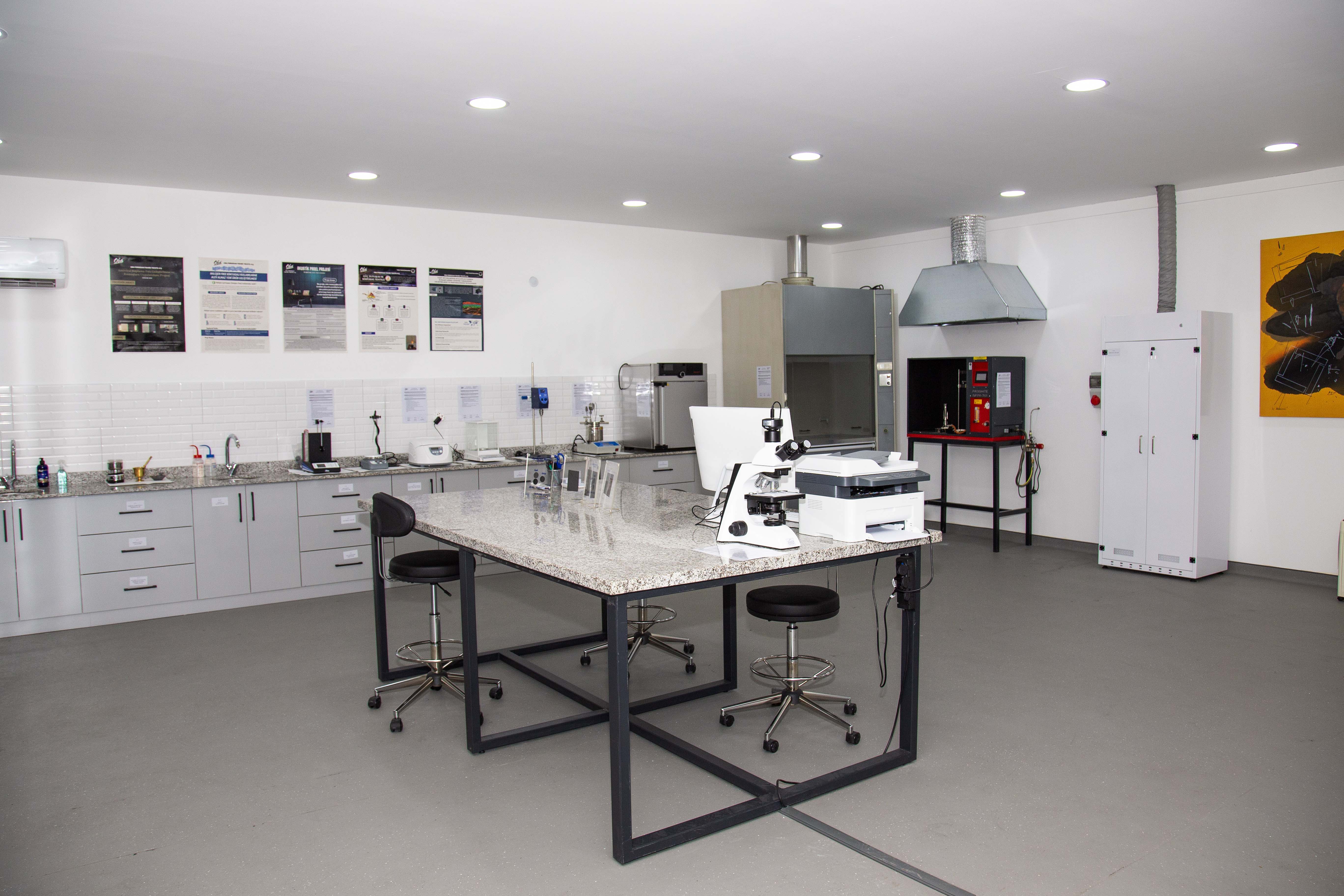 Two people sit across a table in a stylish room with red velvet walls and a large red pendant light. The mood is intimate and modern.
