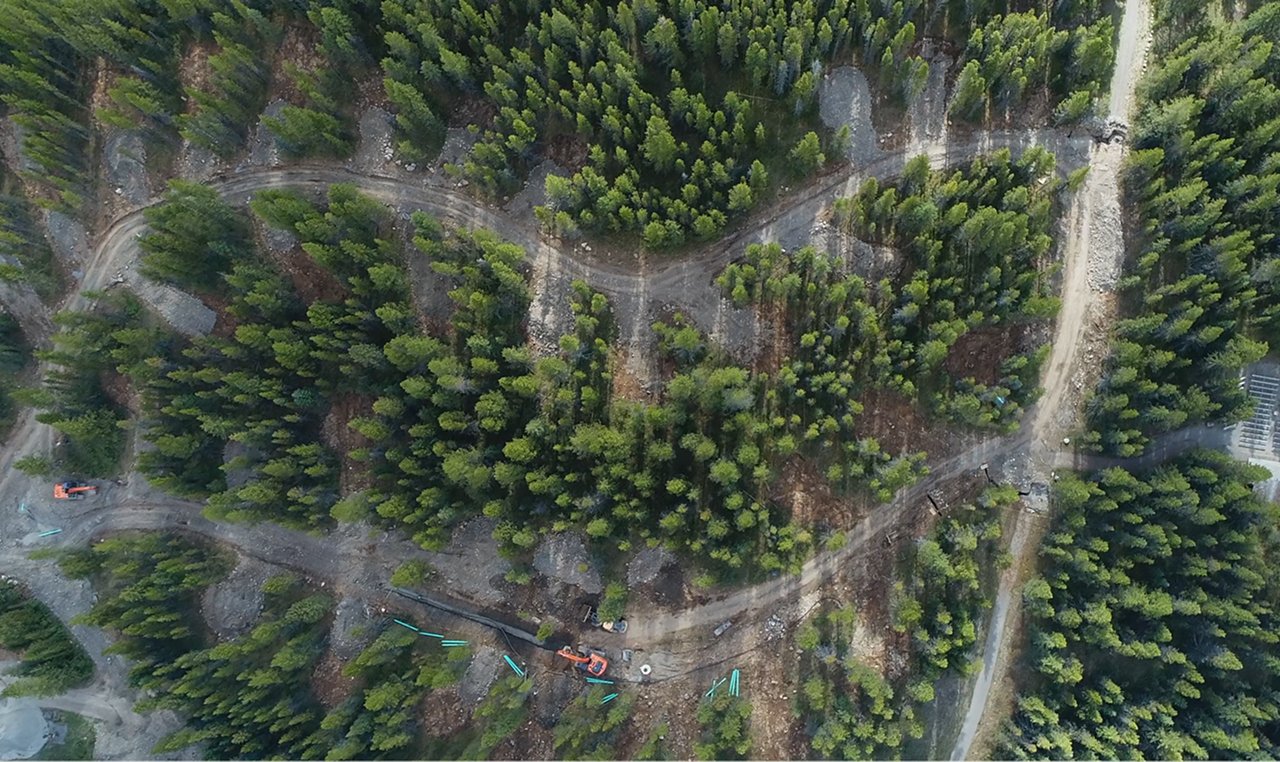 Aerial view of Boulton Creek Campground construction site showing forest clearing and road layout in Kananaskis