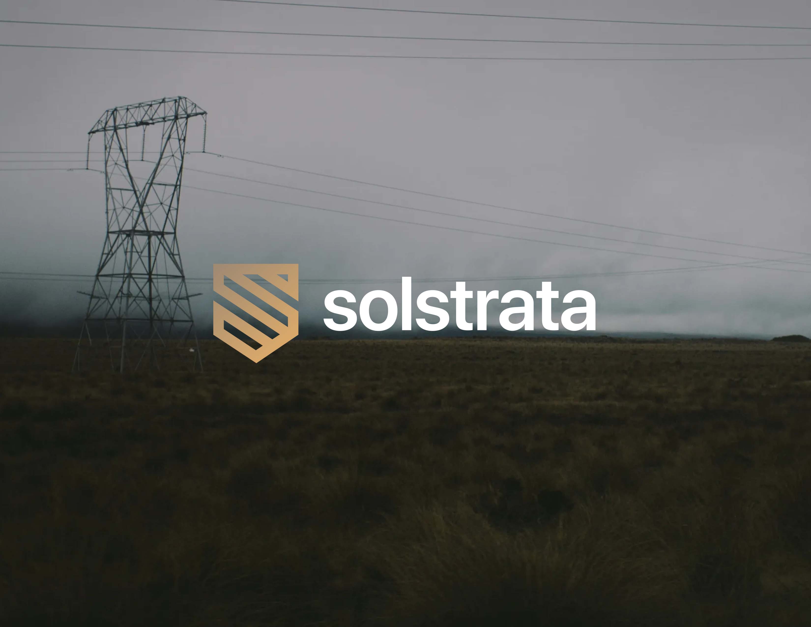 A power line structure in a foggy field with the text 'solstrata' and a logo next to it.